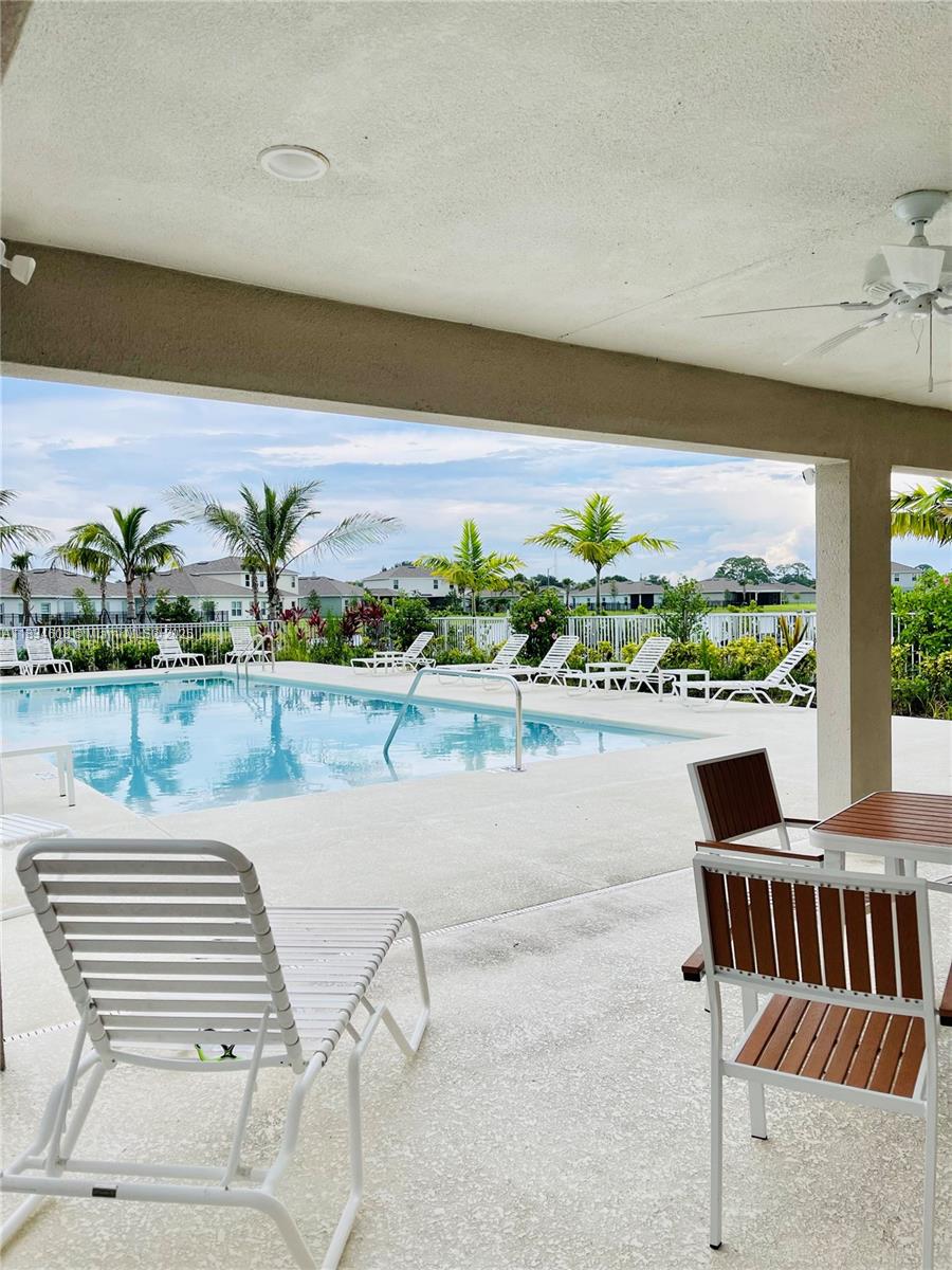 217 Raspberry Road Fort Pierce, FL 34981 - Photo 35 of 39 a view of a chairs and table on the terrace