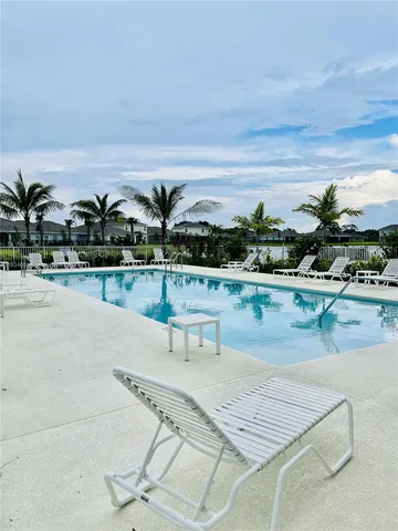 a view of a lake with houses in the back
