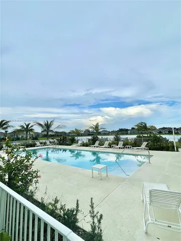 a view of a house with more windows and a pathway