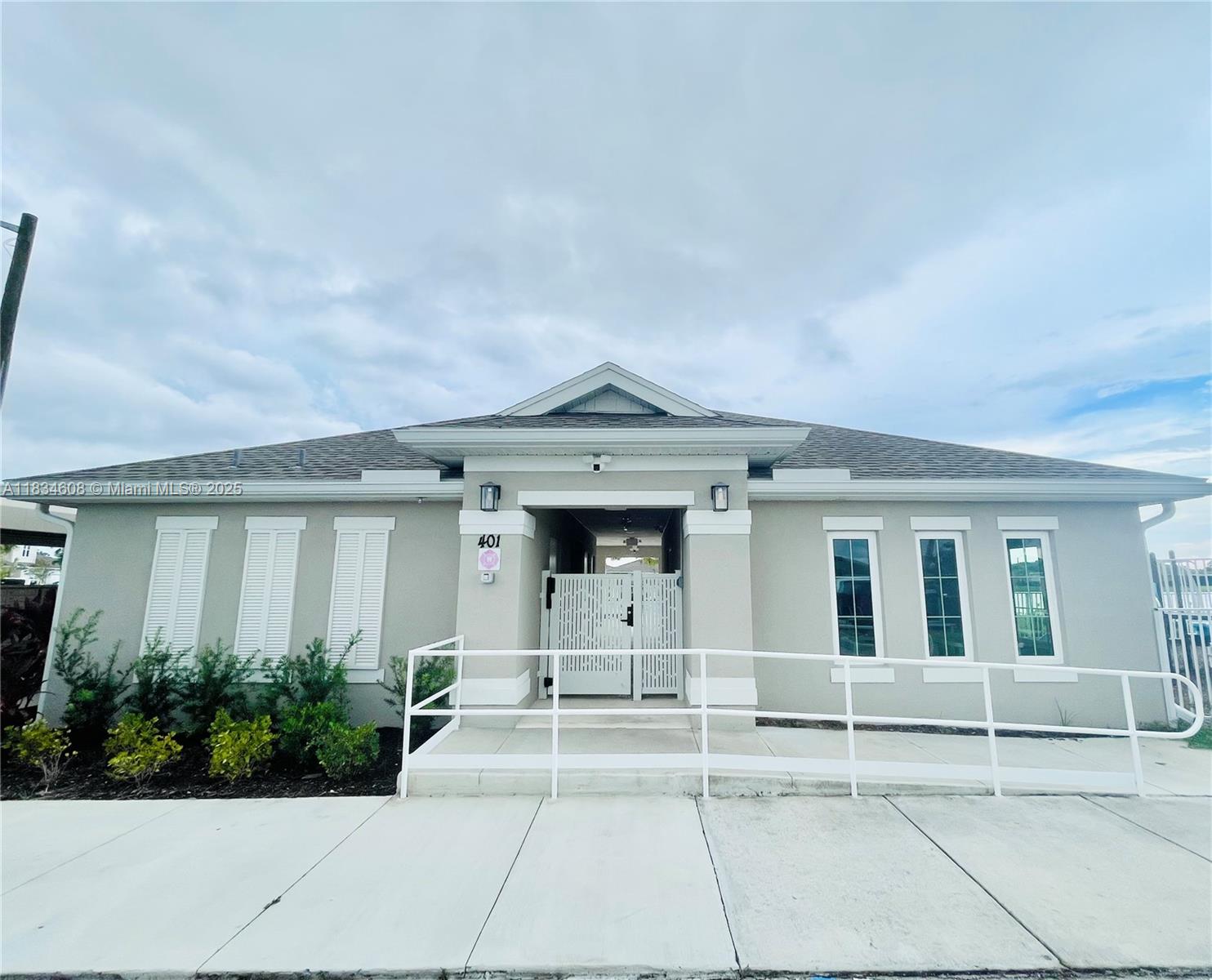 217 Raspberry Road Fort Pierce, FL 34981 - Photo 38 of 39 a view of a house with more windows and a pathway