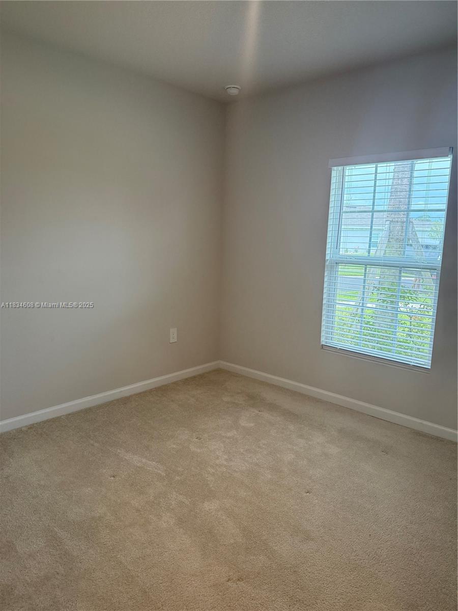 217 Raspberry Road Fort Pierce, FL 34981 - Photo 7 of 39 an empty room with a window