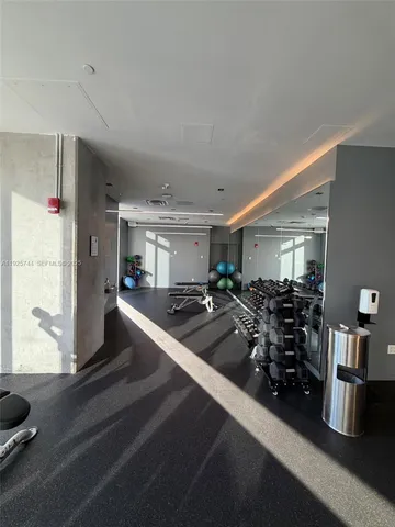 a view of a hallway with seating area
