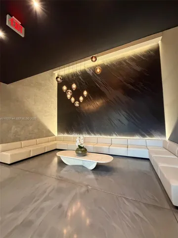 a view of a room with floor to ceiling window and carpet