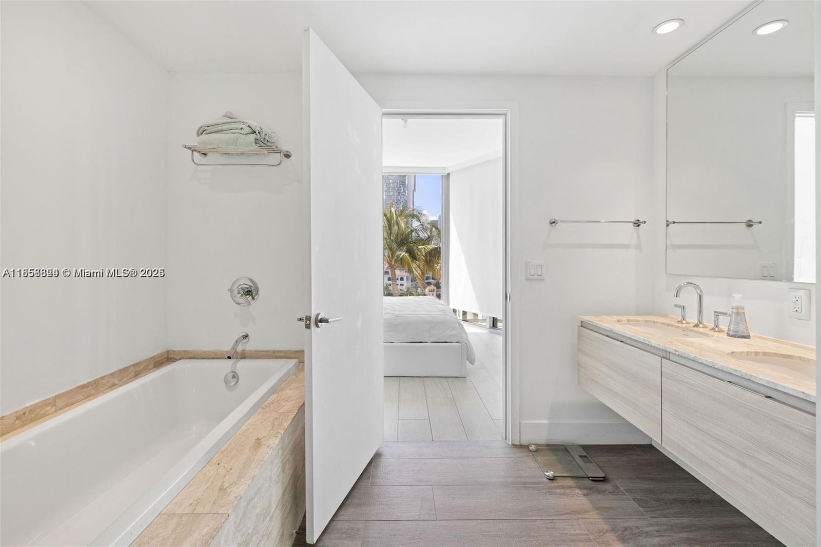 2900 Northeast 7th Avenue, Unit 809 Miami, FL 33137 - Photo 12 of 33 a spacious bathroom with a tub sink and mirror