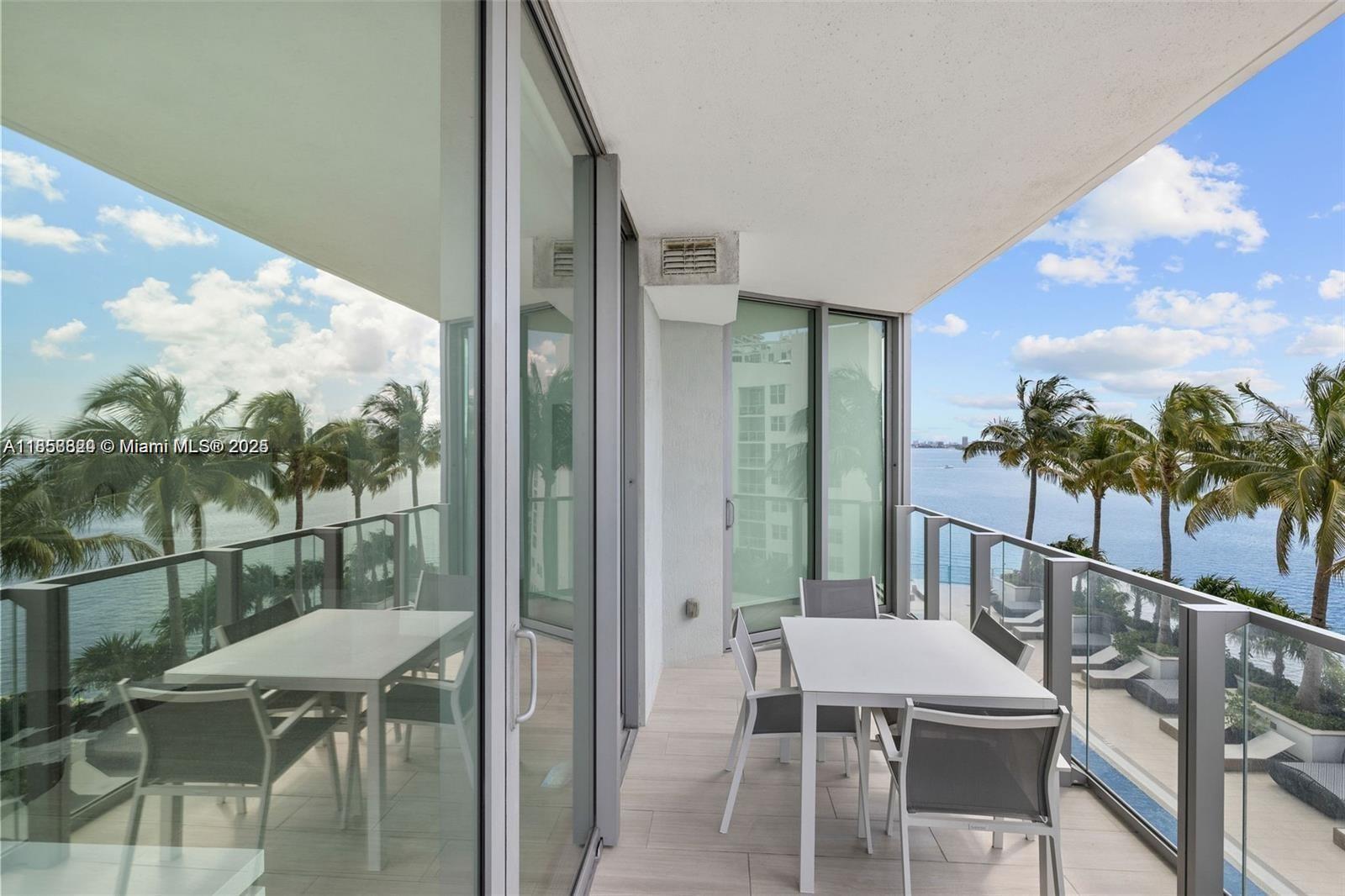 2900 Northeast 7th Avenue, Unit 809 Miami, FL 33137 - Photo 2 of 33 a balcony with table and chairs