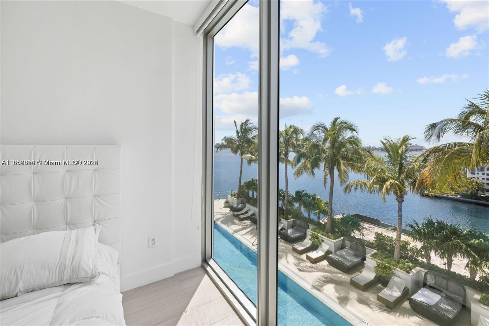 2900 Northeast 7th Avenue, Unit 809 Miami, FL 33137 - Photo 3 of 33 a living room with a couch and a potted plant