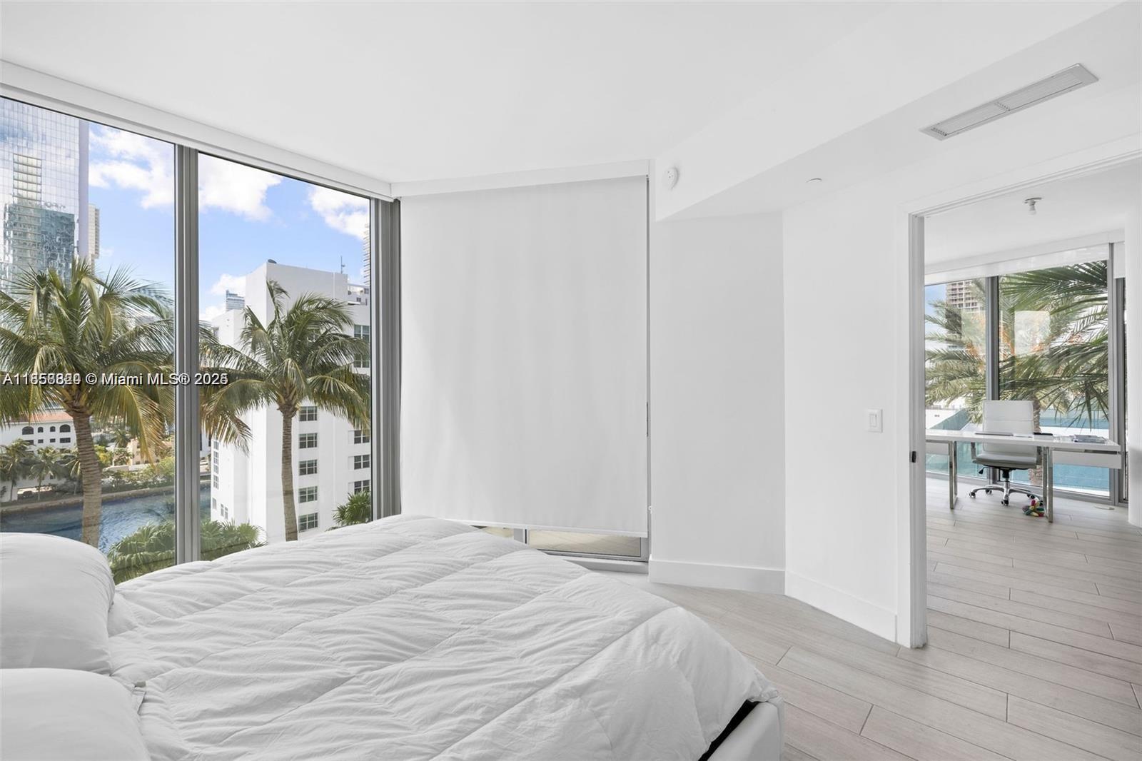 2900 Northeast 7th Avenue, Unit 809 Miami, FL 33137 - Photo 5 of 33 a bedroom with a large bed and a large window
