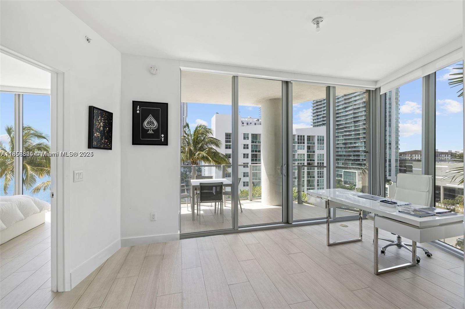 2900 Northeast 7th Avenue, Unit 809 Miami, FL 33137 - Photo 7 of 33 a living room with furniture and a floor to ceiling window