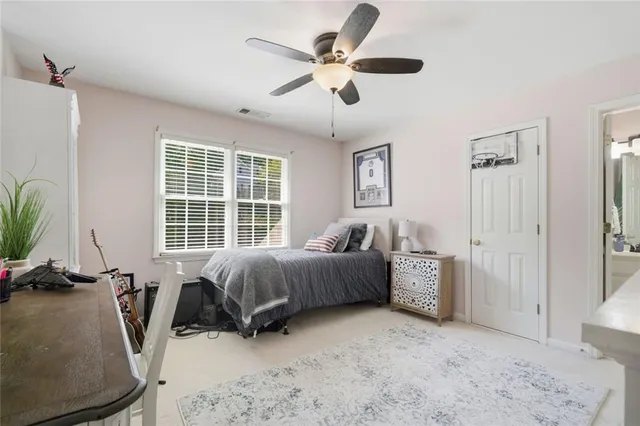 a bed room with furniture and a window