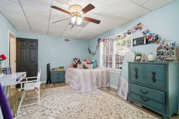 a bed room with a bed and a window