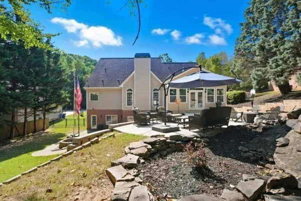 a view of a patio with chairs and tables