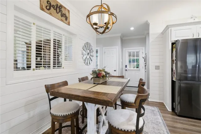 a view of a dining room with furniture and a window