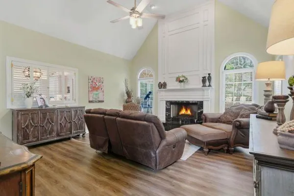 a living room with furniture and a fireplace