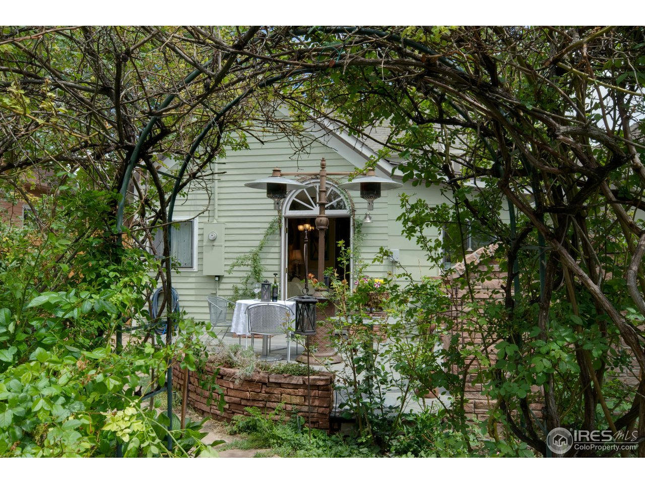 406 East Baseline Road Lafayette, CO 80026 - Photo 17 of 24 a view of a house with a tree