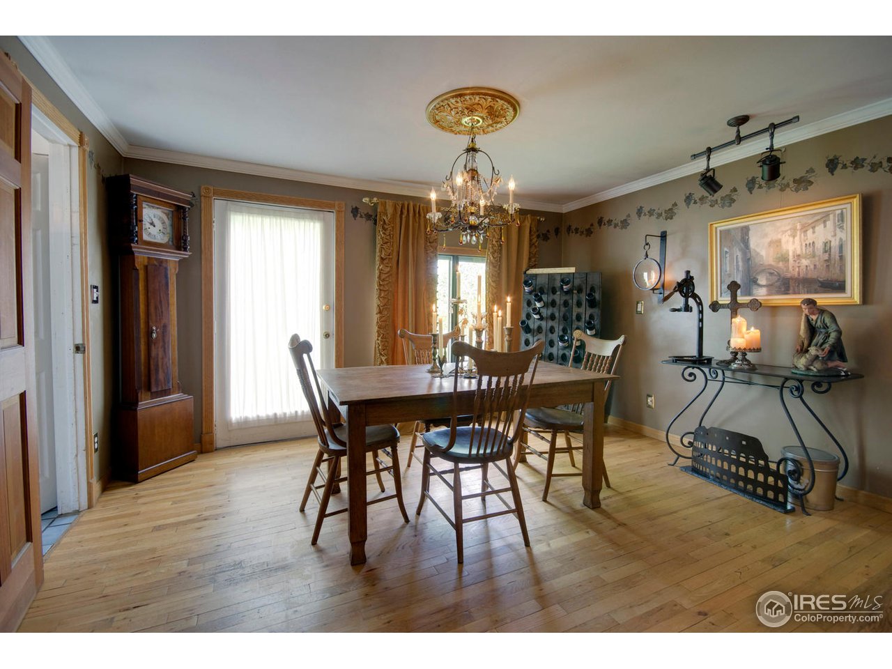 406 East Baseline Road Lafayette, CO 80026 - Photo 10 of 24 a view of a dining room with furniture and wooden floor