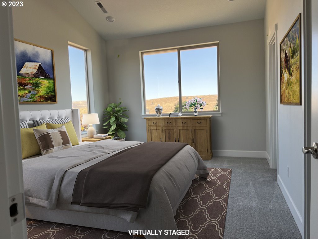 1435 Fish Tail Road Maupin, OR 97037 - Photo 15 of 31 a bedroom with a bed and a large window