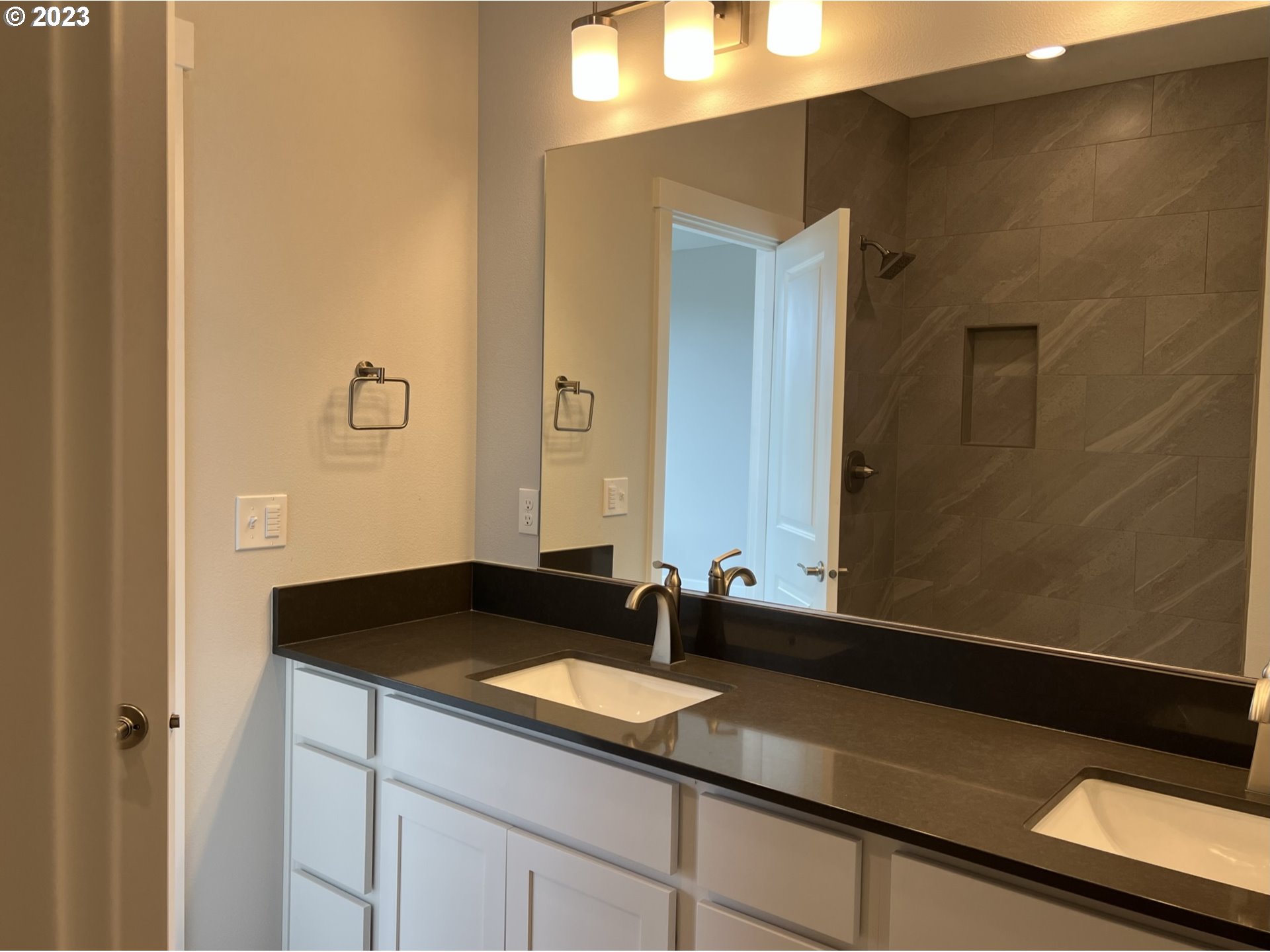 1435 Fish Tail Road Maupin, OR 97037 - Photo 17 of 31 a bathroom with a granite countertop sink and a mirror
