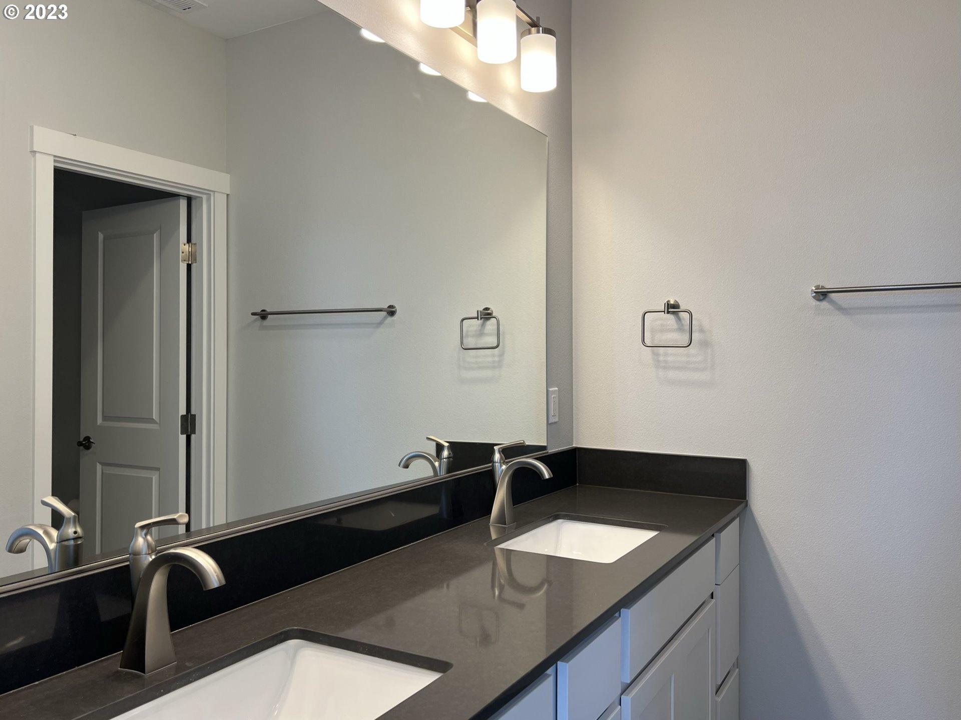 1435 Fish Tail Road Maupin, OR 97037 - Photo 18 of 31 a bathroom with a granite countertop sink and a mirror
