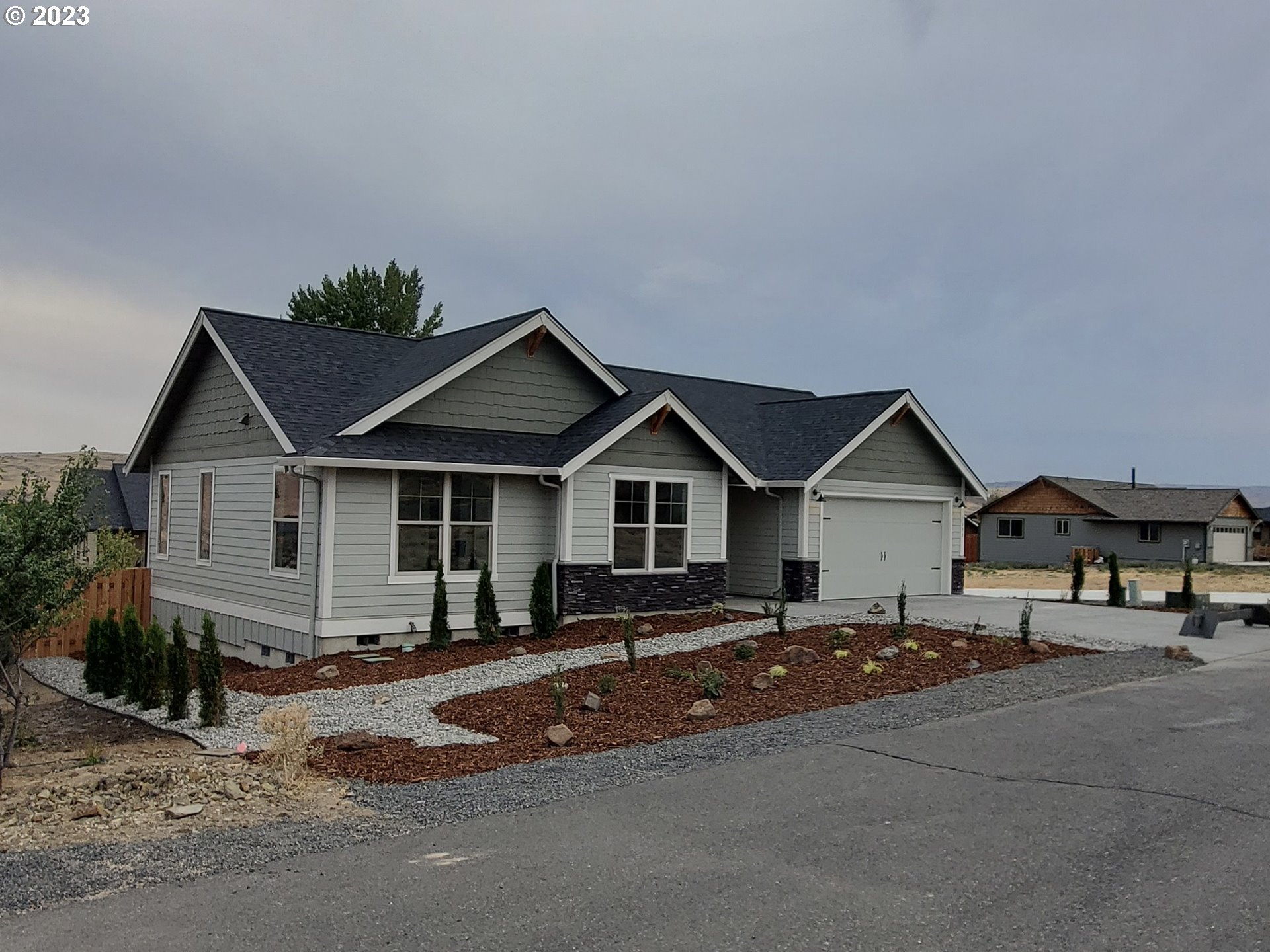 1435 Fish Tail Road Maupin, OR 97037 - Photo 24 of 31 a view of a house with a big yard and large trees