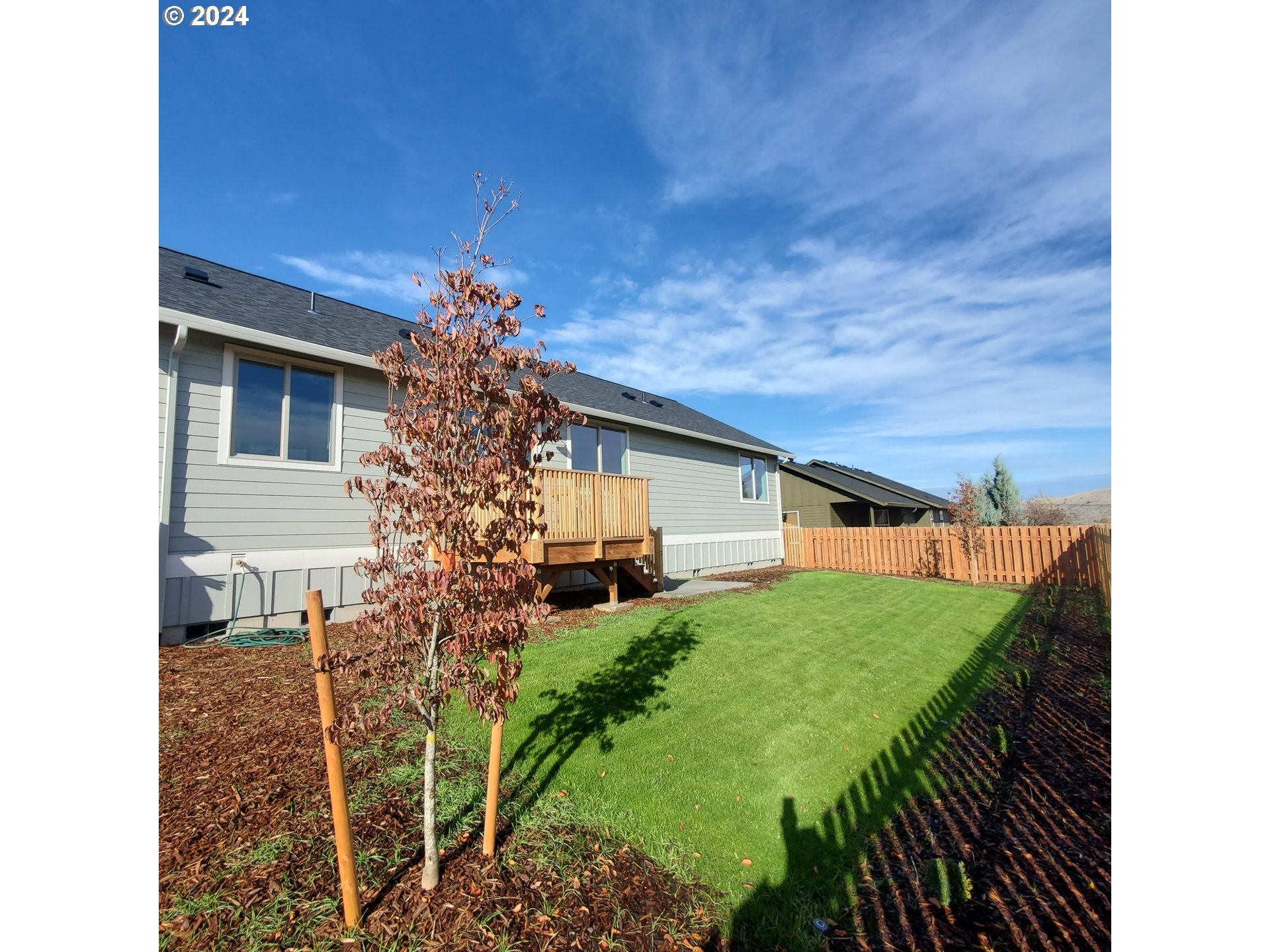 1435 Fish Tail Road Maupin, OR 97037 - Photo 26 of 31 a backyard of a house with table and chairs