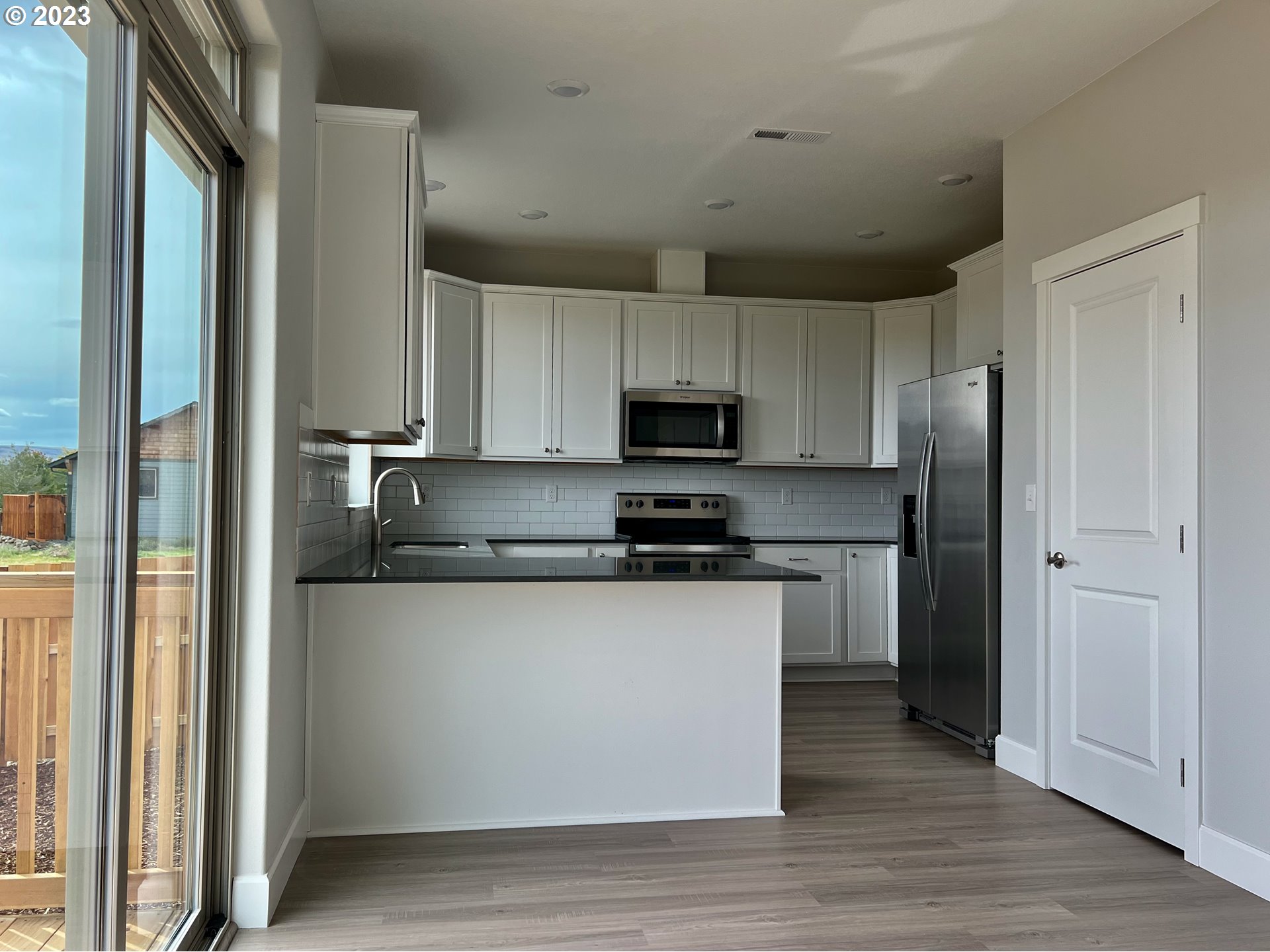 1435 Fish Tail Road Maupin, OR 97037 - Photo 6 of 31 a kitchen with stainless steel appliances granite countertop a refrigerator and a stove top oven