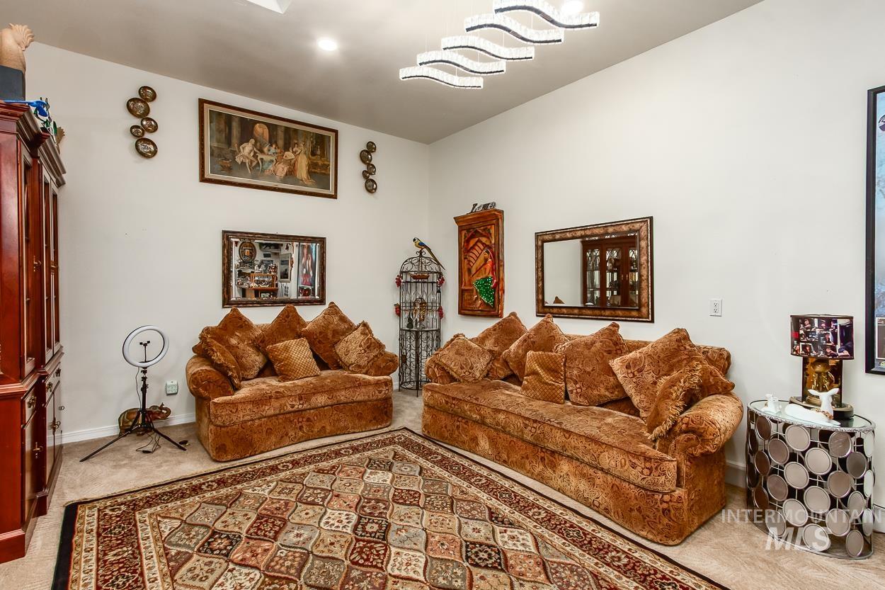 5674 North Heathrow Way Boise, ID 83713 - Photo 15 of 41 Spacious room featuring high ceilings and carpet flooring