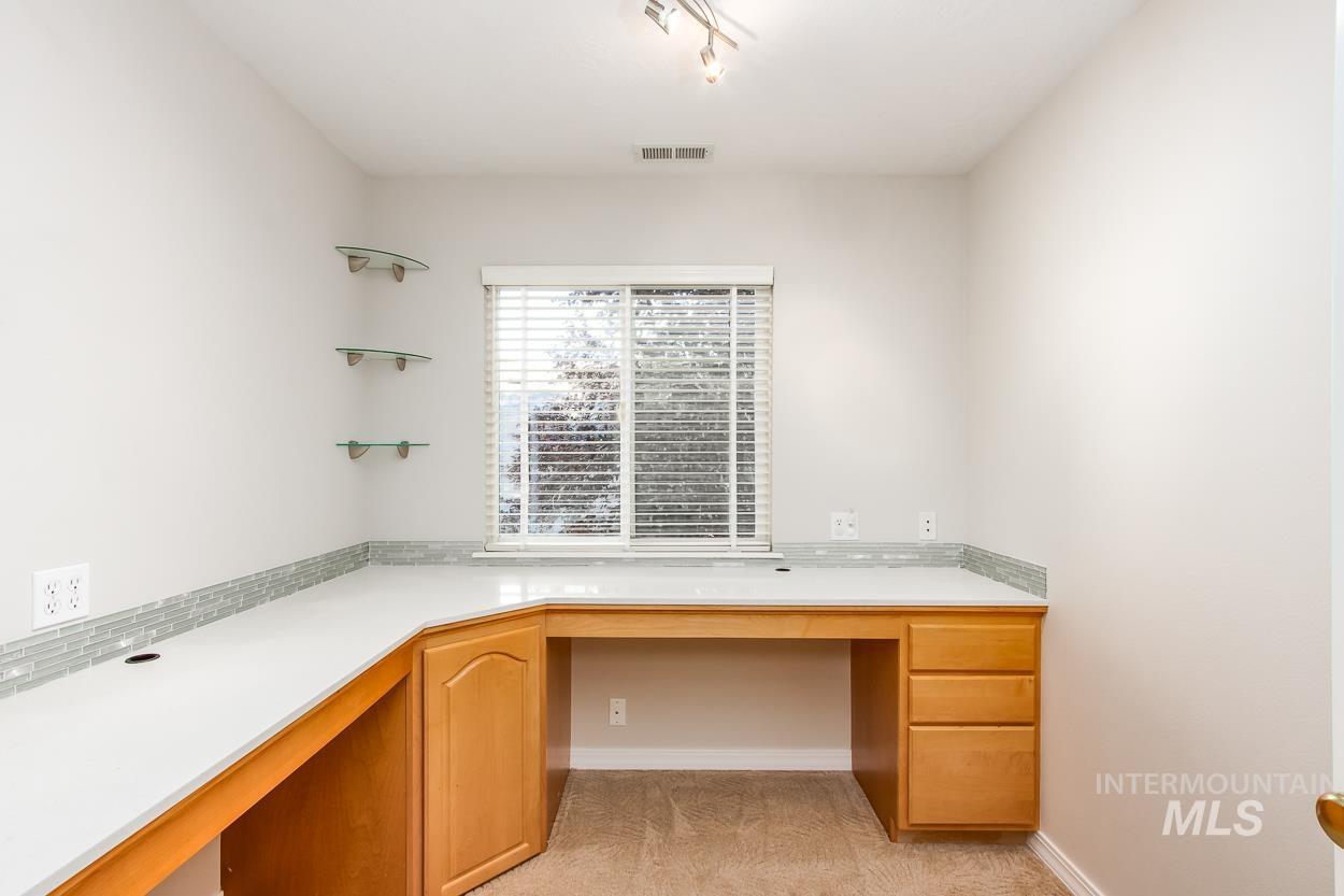 5674 North Heathrow Way Boise, ID 83713 - Photo 21 of 41 Built-in wood-finish desk with a wrap-around countertop