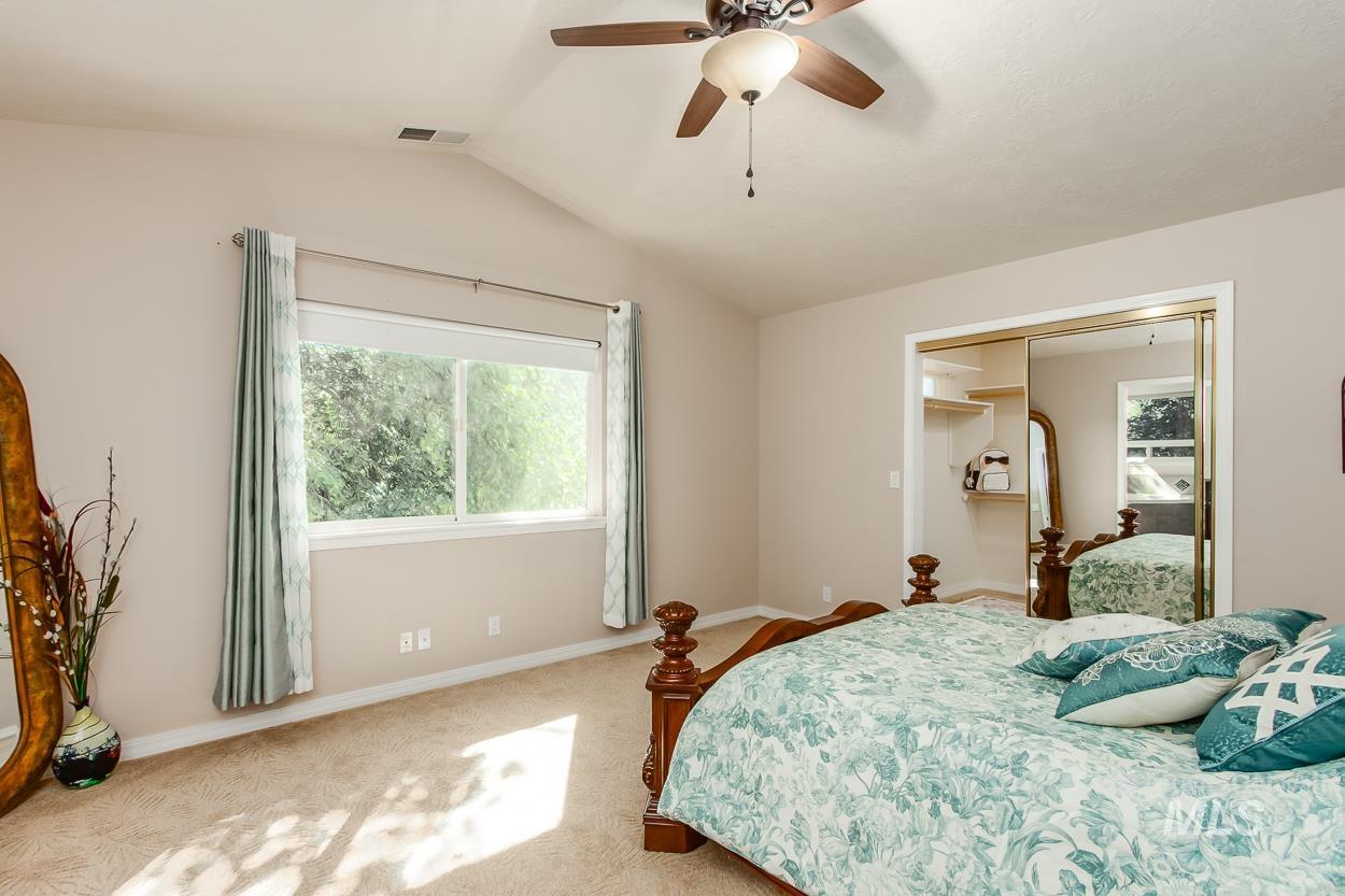 5674 North Heathrow Way Boise, ID 83713 - Photo 23 of 41 Vaulted ceiling featuring a ceiling fan with integrated lighting