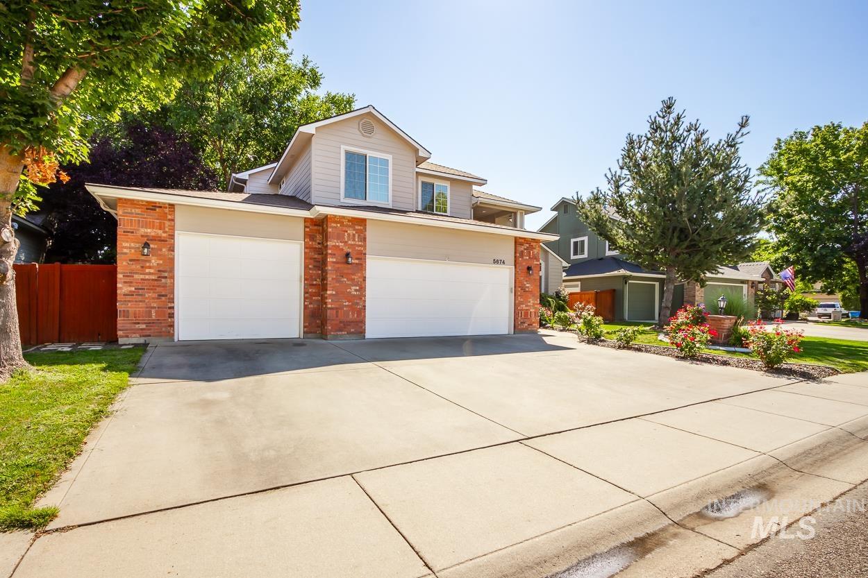 5674 North Heathrow Way Boise, ID 83713 - Photo 40 of 41 Two-story exterior with light-toned siding and brick accents