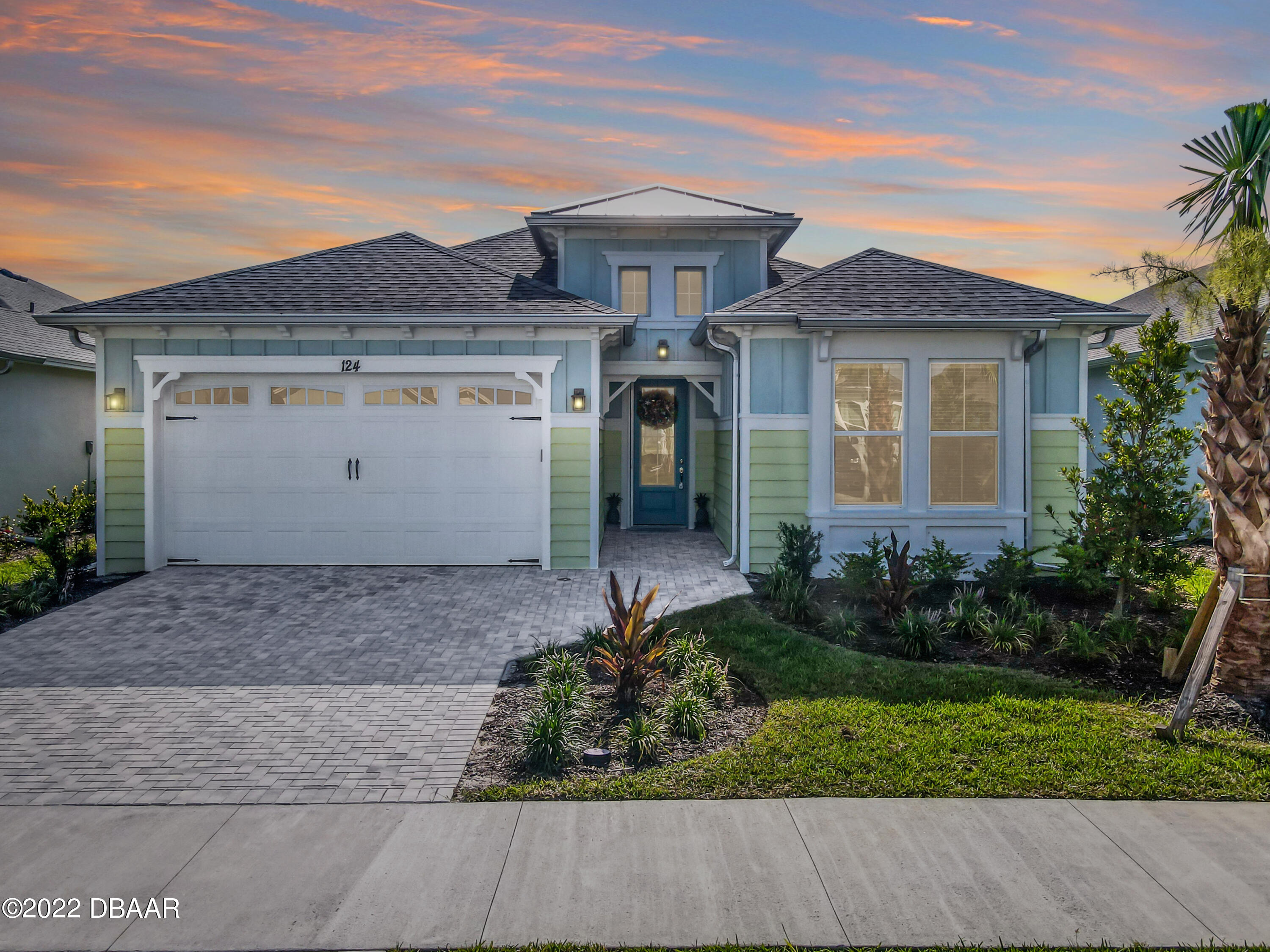 front view of a house with a yard