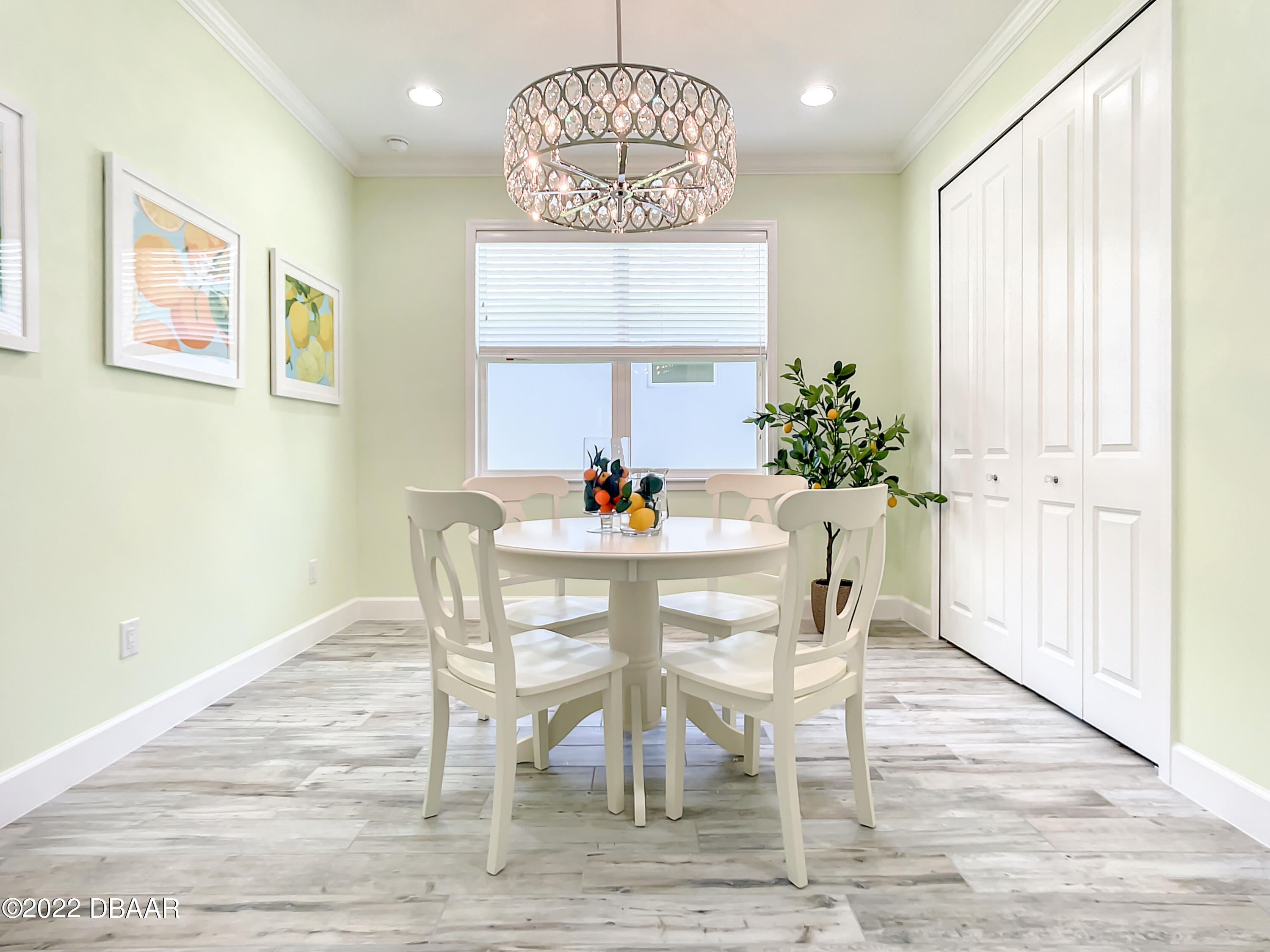 124 Red Lighthouse Point Daytona Beach, FL 32124 - Photo 11 of 54 a dining room with furniture a rug and wooden floor