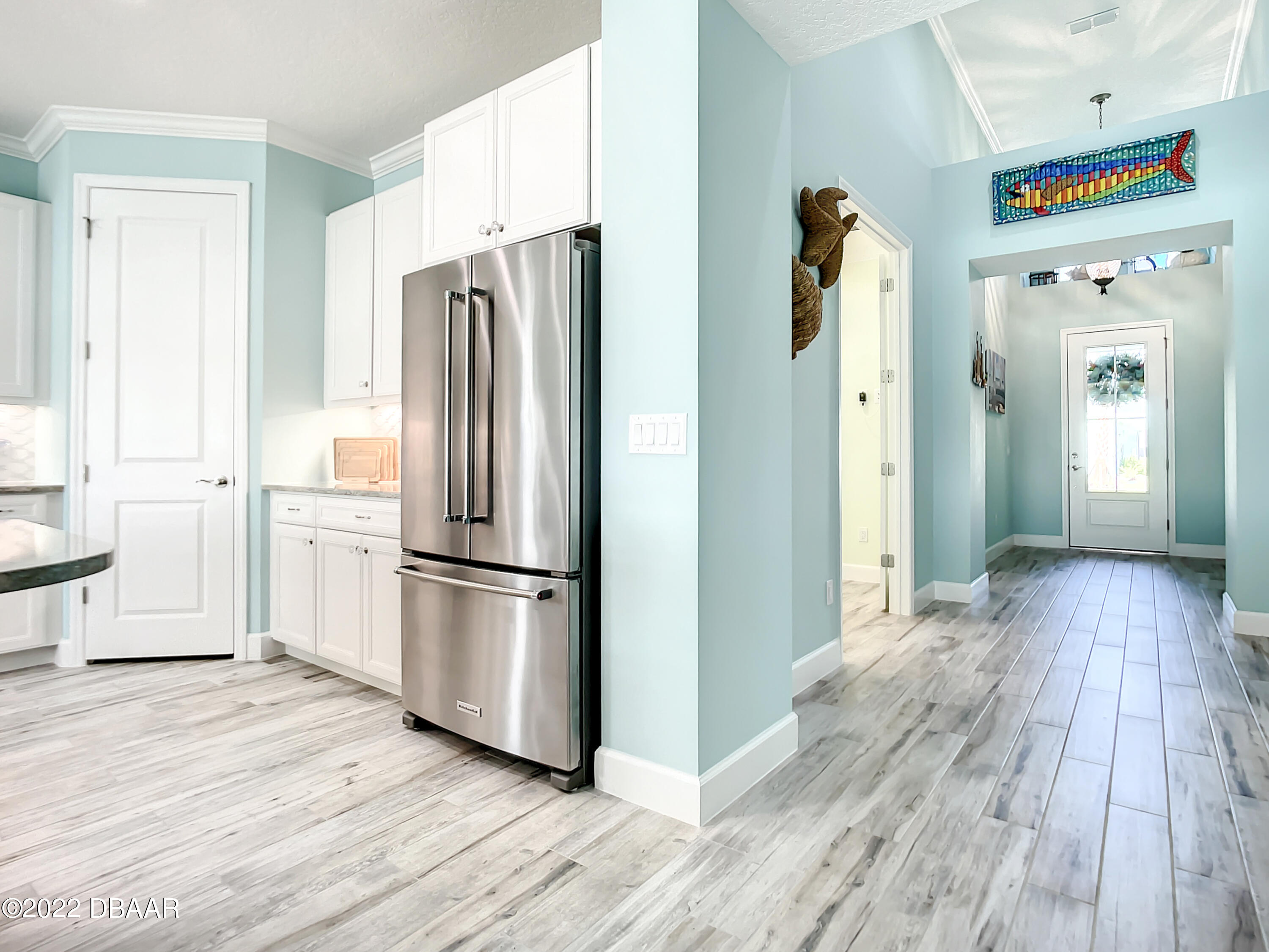 124 Red Lighthouse Point Daytona Beach, FL 32124 - Photo 12 of 54 a kitchen with stainless steel appliances a refrigerator and wooden floor