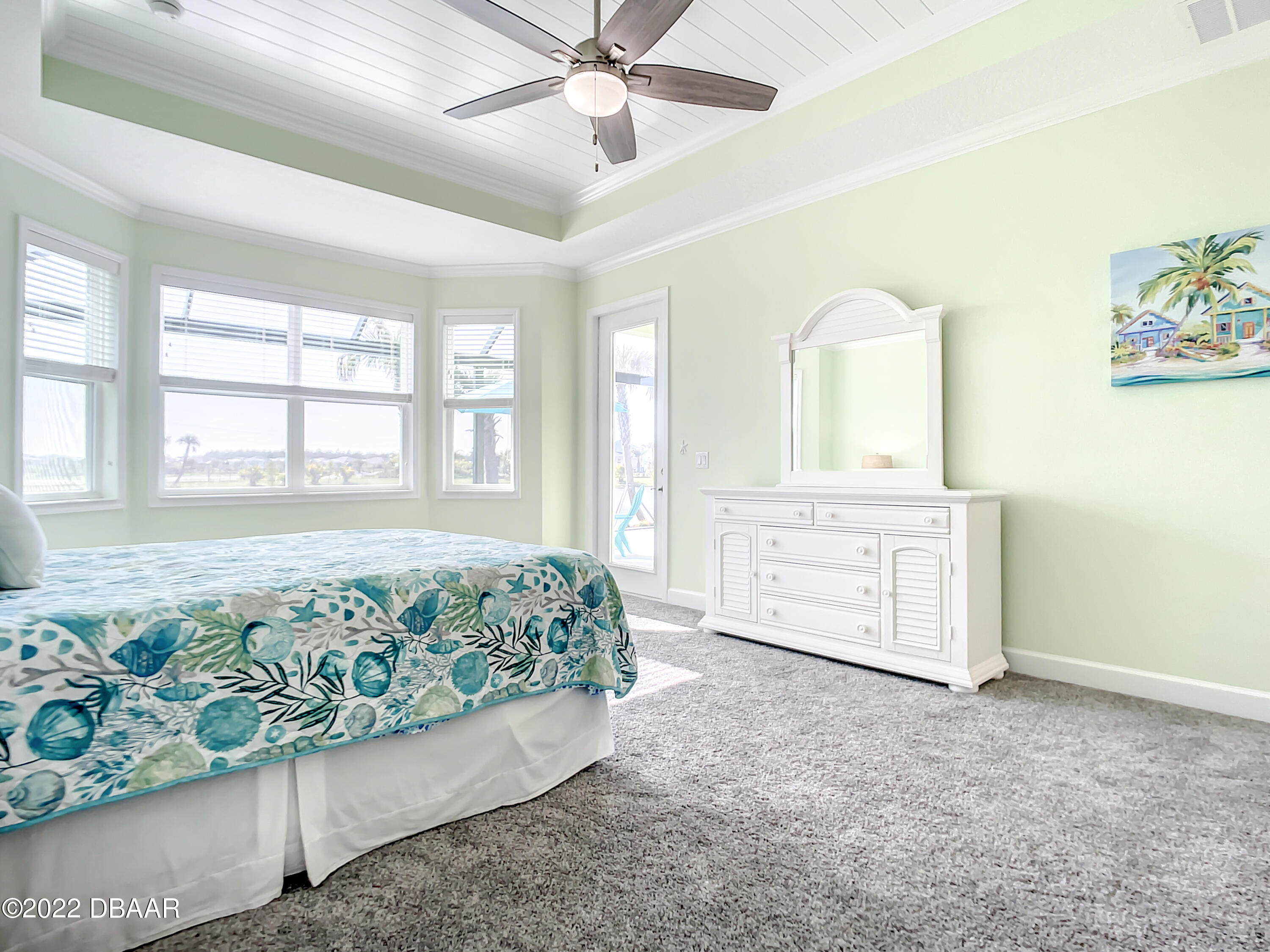 124 Red Lighthouse Point Daytona Beach, FL 32124 - Photo 17 of 54 a spacious bedroom with a bed and a cabinets