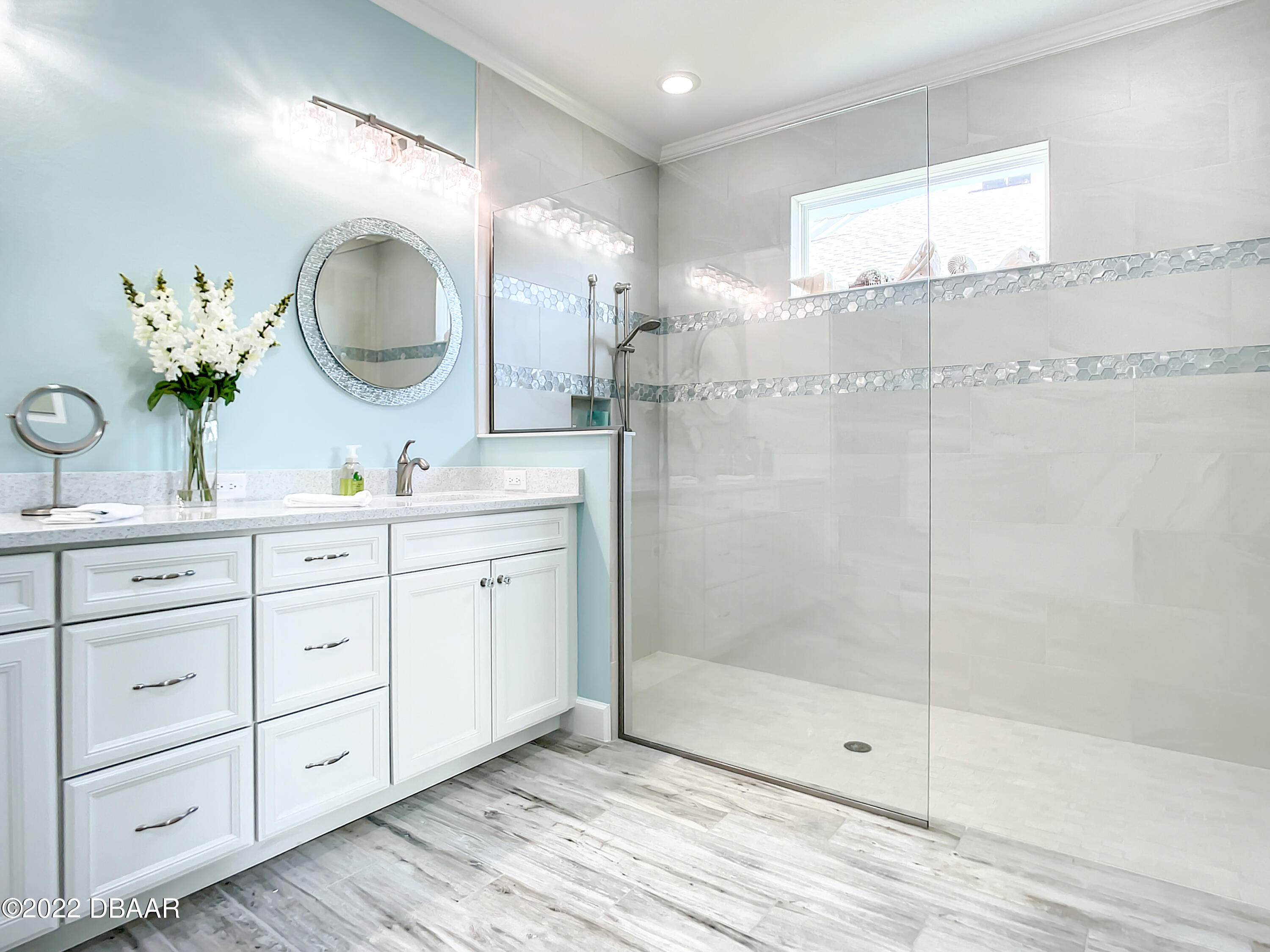 124 Red Lighthouse Point Daytona Beach, FL 32124 - Photo 21 of 54 a bathroom with a double vanity sink mirror and shower