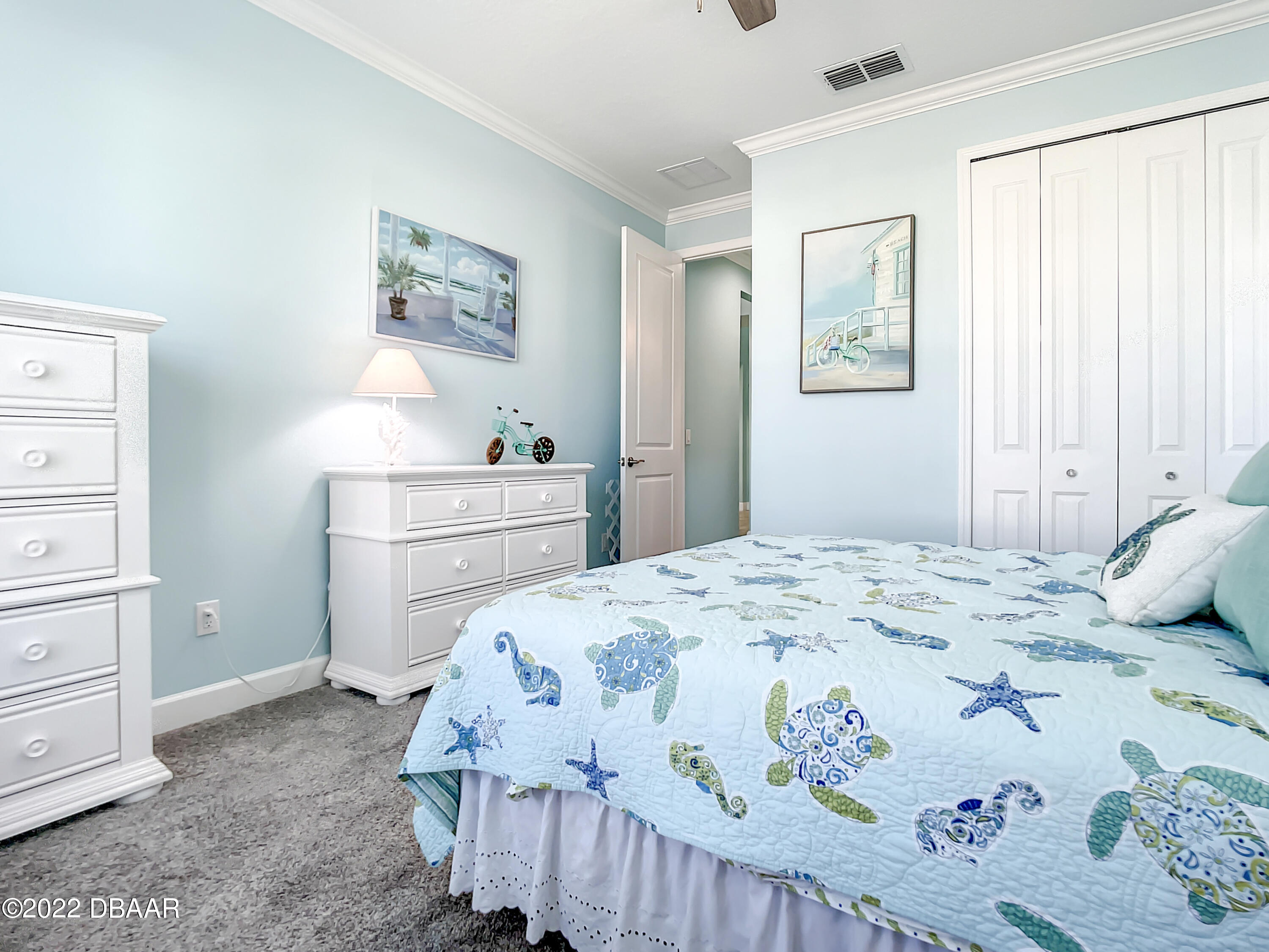 124 Red Lighthouse Point Daytona Beach, FL 32124 - Photo 30 of 54 a bedroom with a bed and a dresser in it