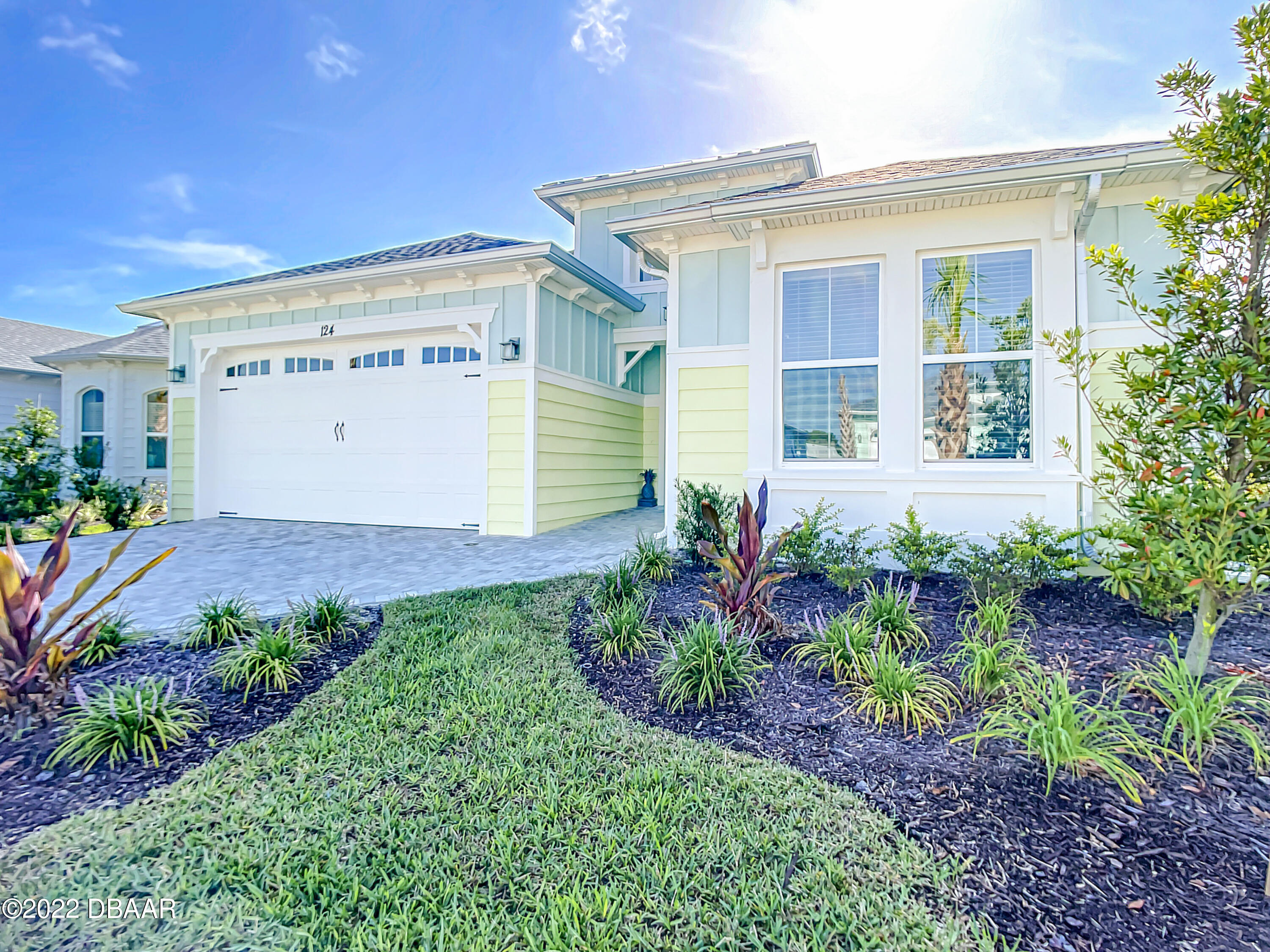 124 Red Lighthouse Point Daytona Beach, FL 32124 - Photo 3 of 54 a front view of a house with a yard