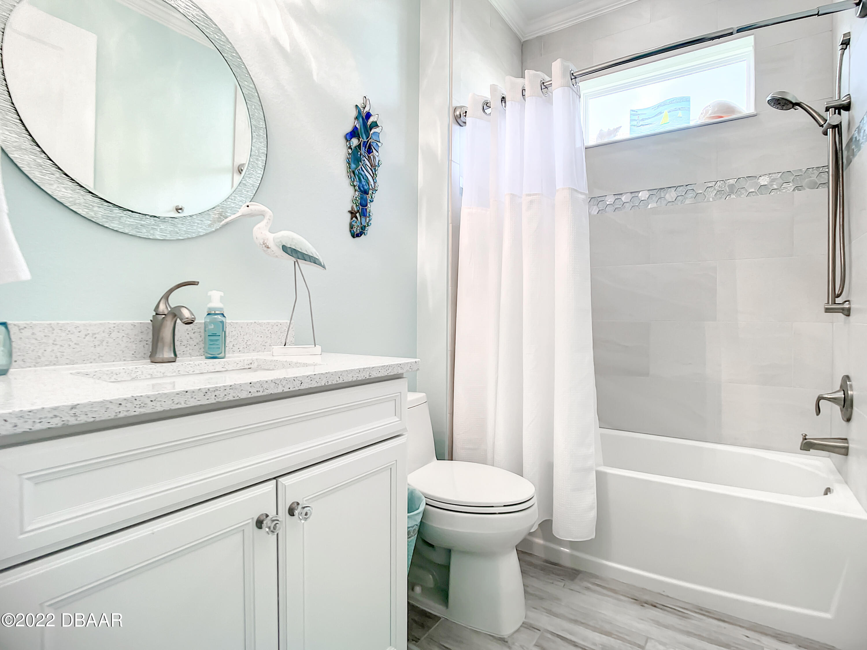 124 Red Lighthouse Point Daytona Beach, FL 32124 - Photo 31 of 54 a bathroom with a sink a toilet and a mirror