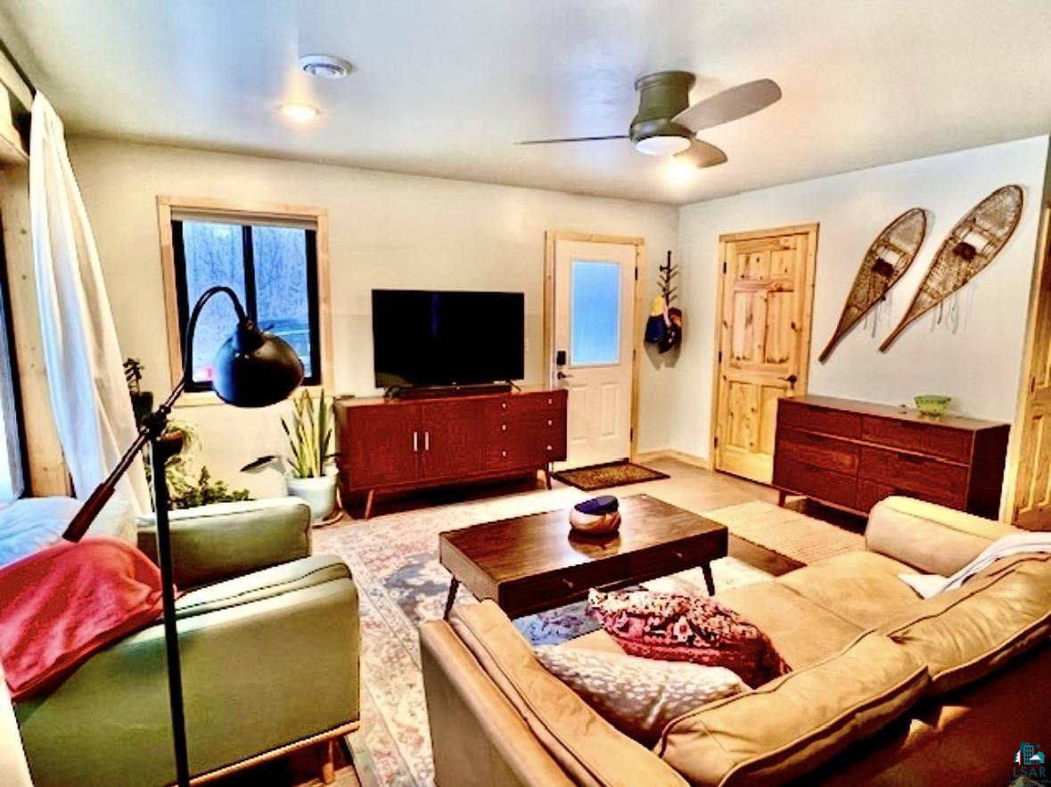 265 Mink Ranch Road Lutsen, MN 55612 - Photo 8 of 32 Living area with a ceiling fan