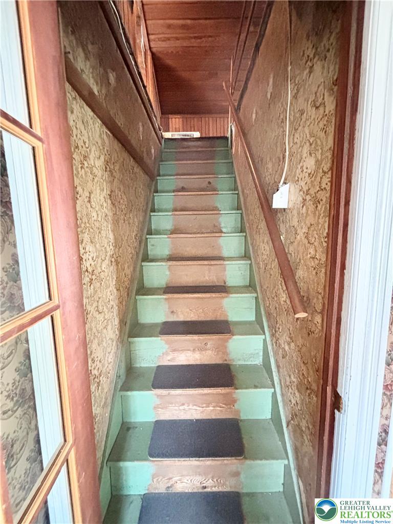7241 Decatur Street New Tripoli, PA 18066 - Photo 26 of 36 Ascend to comfort with these naturally illuminated wooden steps, guiding you to private upper retreats.
