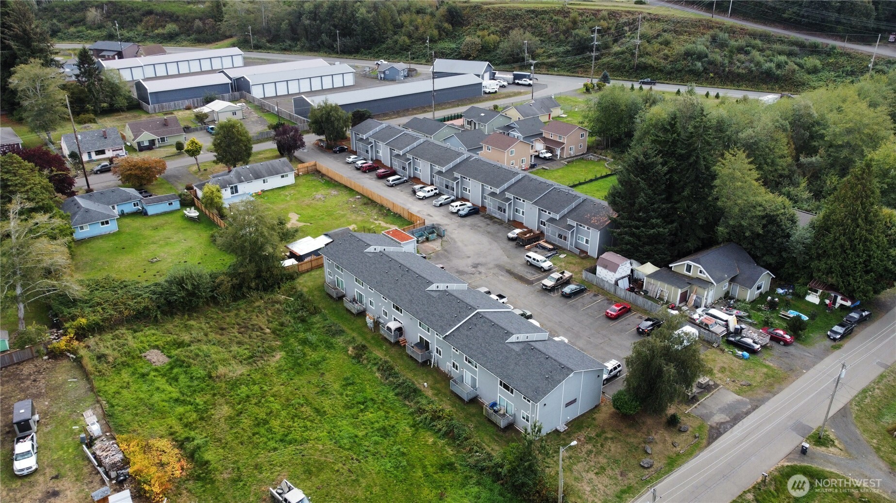 1913 Coolidge Road Aberdeen, WA 98520 - Photo 2 of 18 an aerial view of residential houses with outdoor space and river