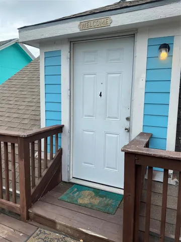 a view of a porch with a table and chair