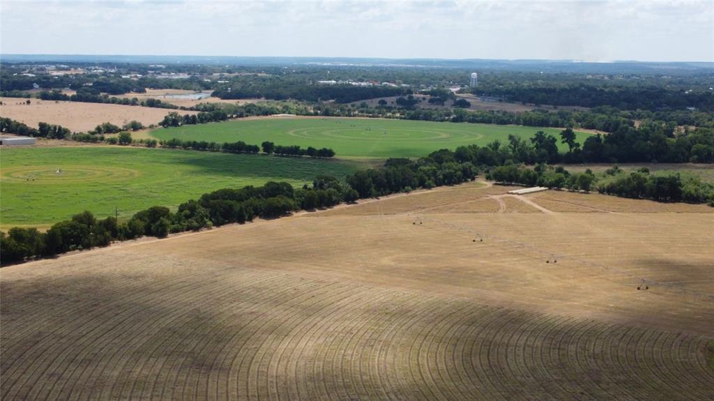 410 State School Road Gatesville, TX 76528 - Photo 5 of 39 Expansive agricultural land featuring cultivated fields, natural tree lines, and distant open spaces