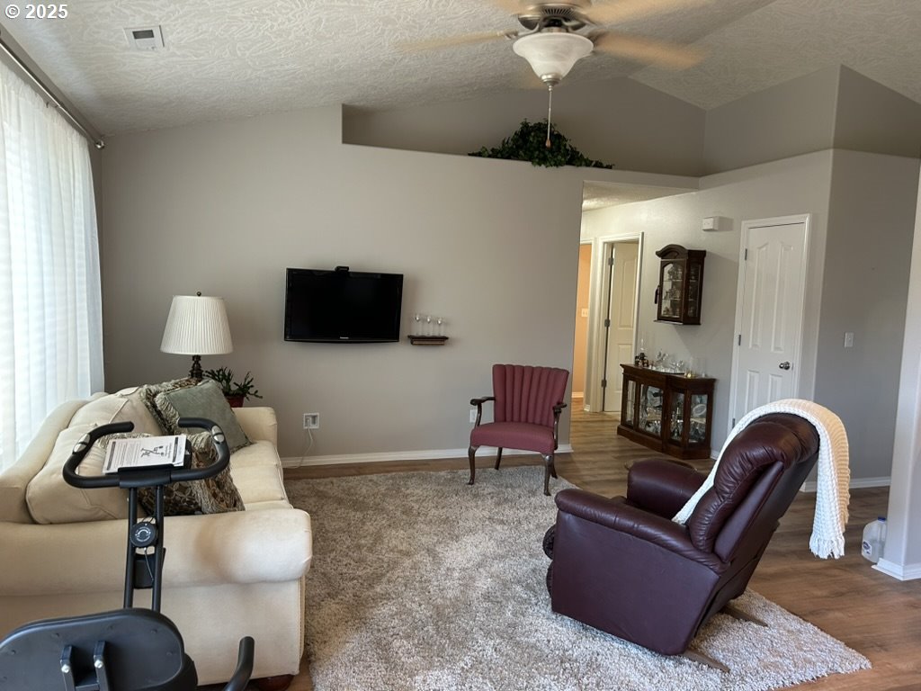 736 Kelsey Loop Molalla, OR 97038 - Photo 10 of 21 a living room with furniture and a flat screen tv