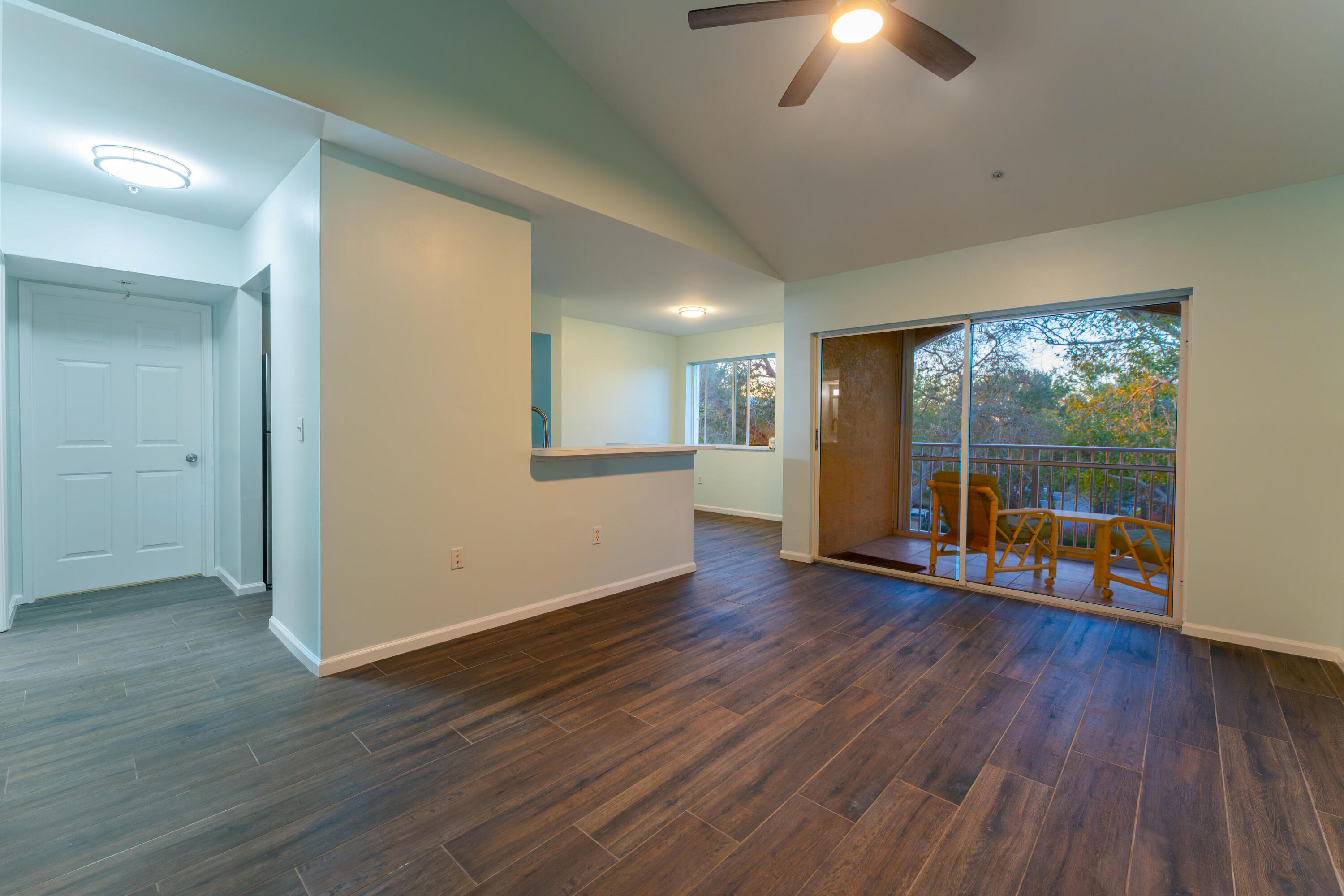 236 Village Boulevard, Unit 1304 Tequesta, FL 33469 - Photo 1 of 30 a view of an empty room with wooden floor and a window