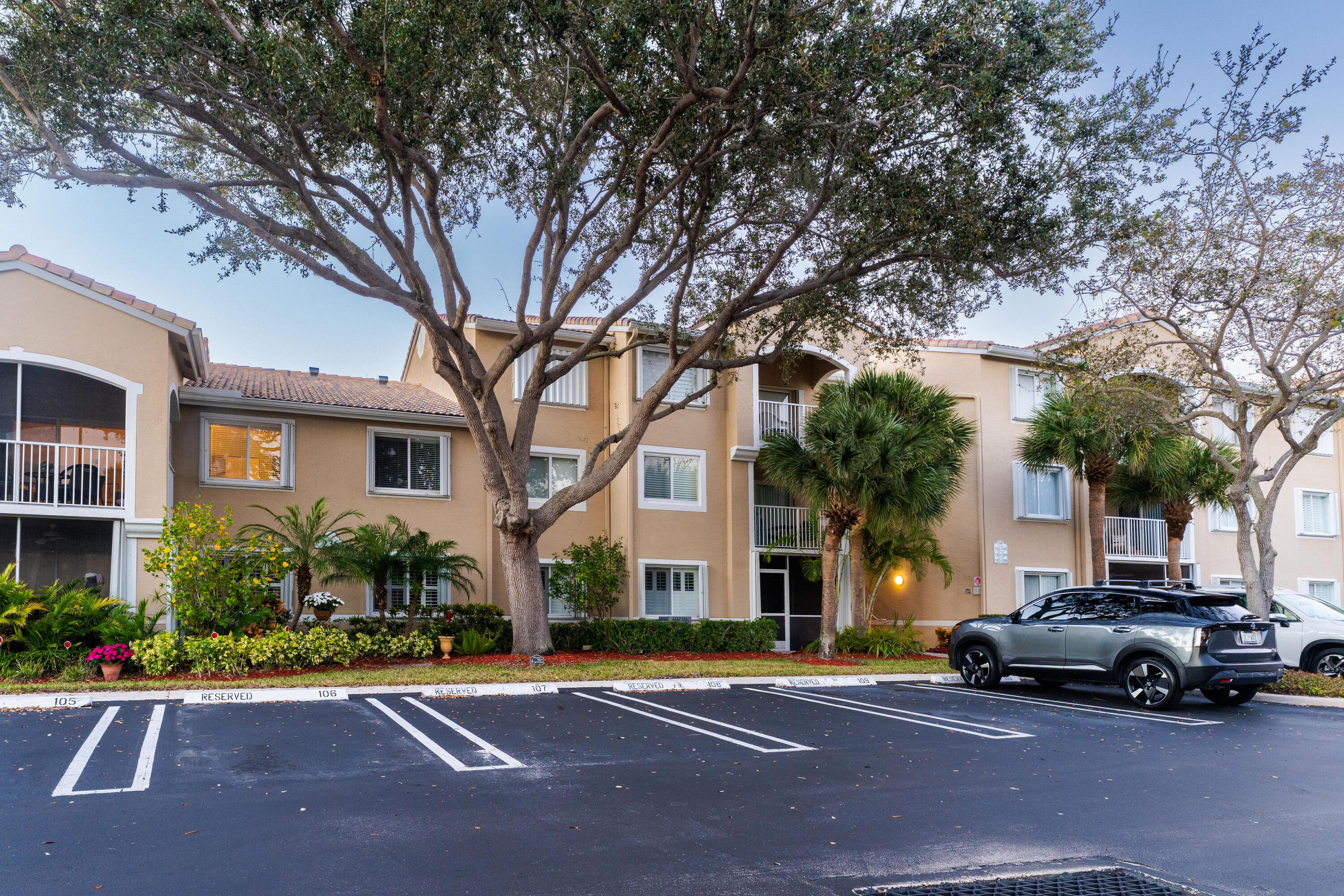 236 Village Boulevard, Unit 1304 Tequesta, FL 33469 - Photo 16 of 30 a car parked in front of a brick house