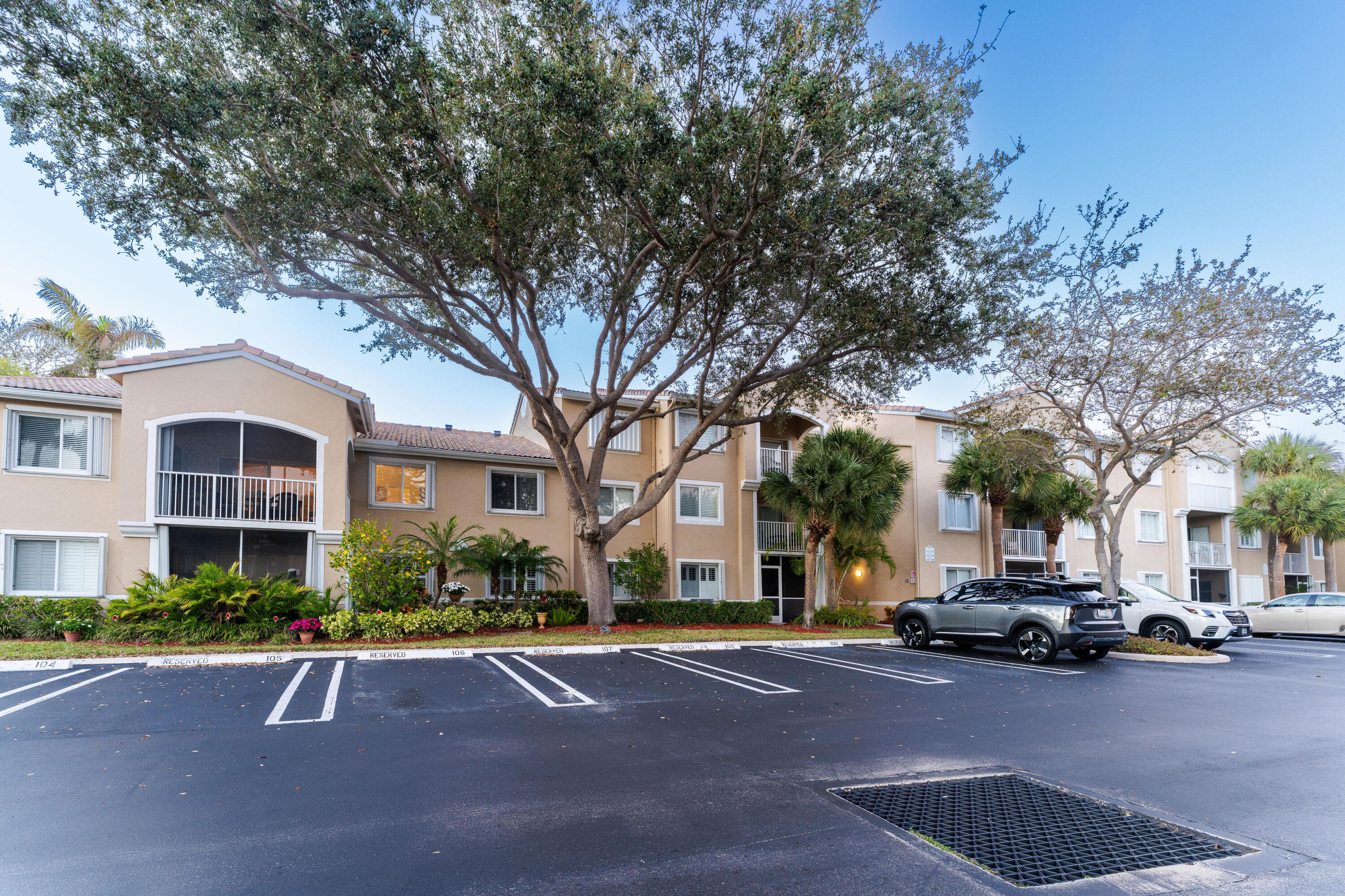 236 Village Boulevard, Unit 1304 Tequesta, FL 33469 - Photo 19 of 30 a view of a street with cars parked
