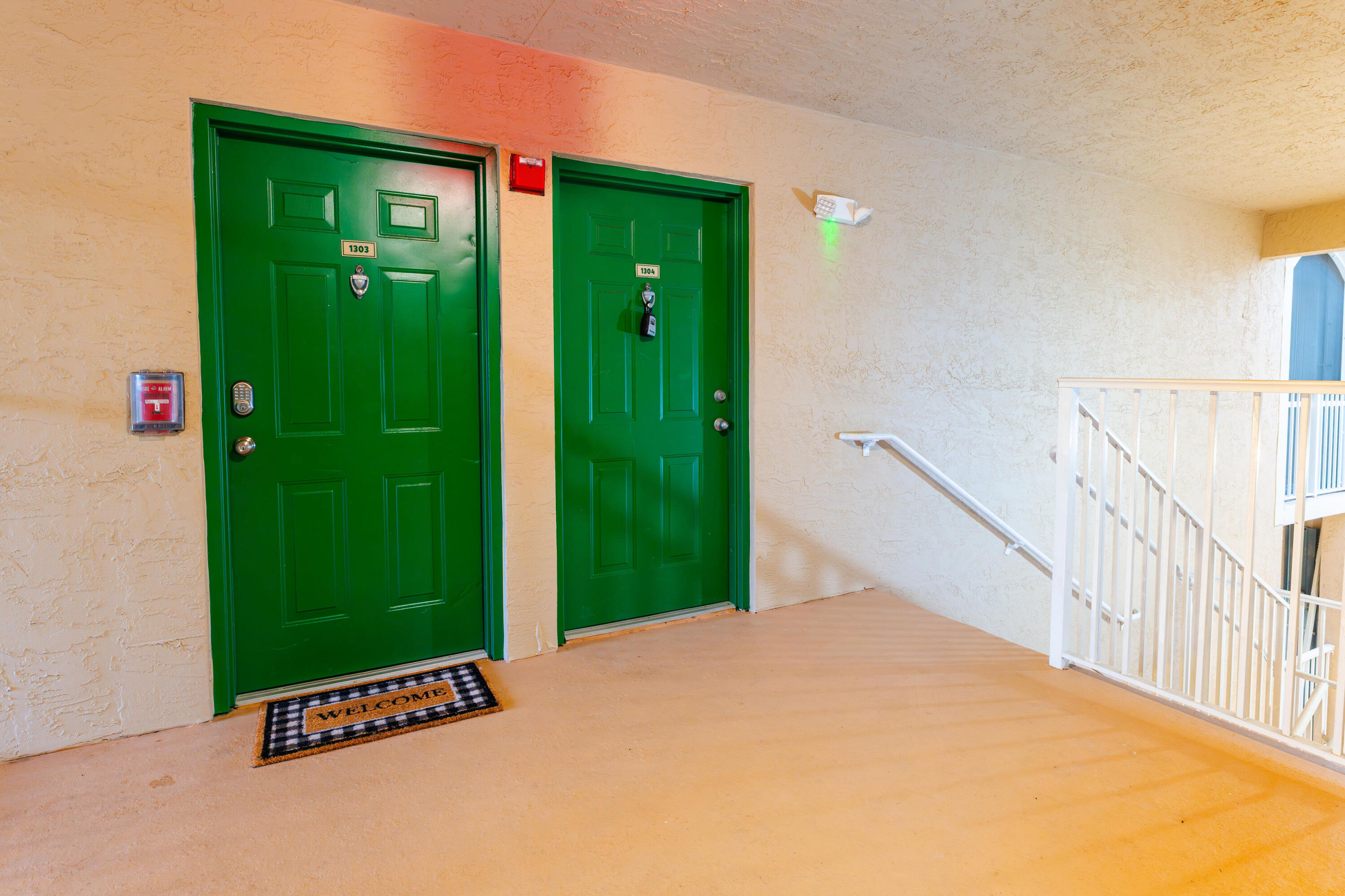 236 Village Boulevard, Unit 1304 Tequesta, FL 33469 - Photo 20 of 30 a view of a backyard door with a yard