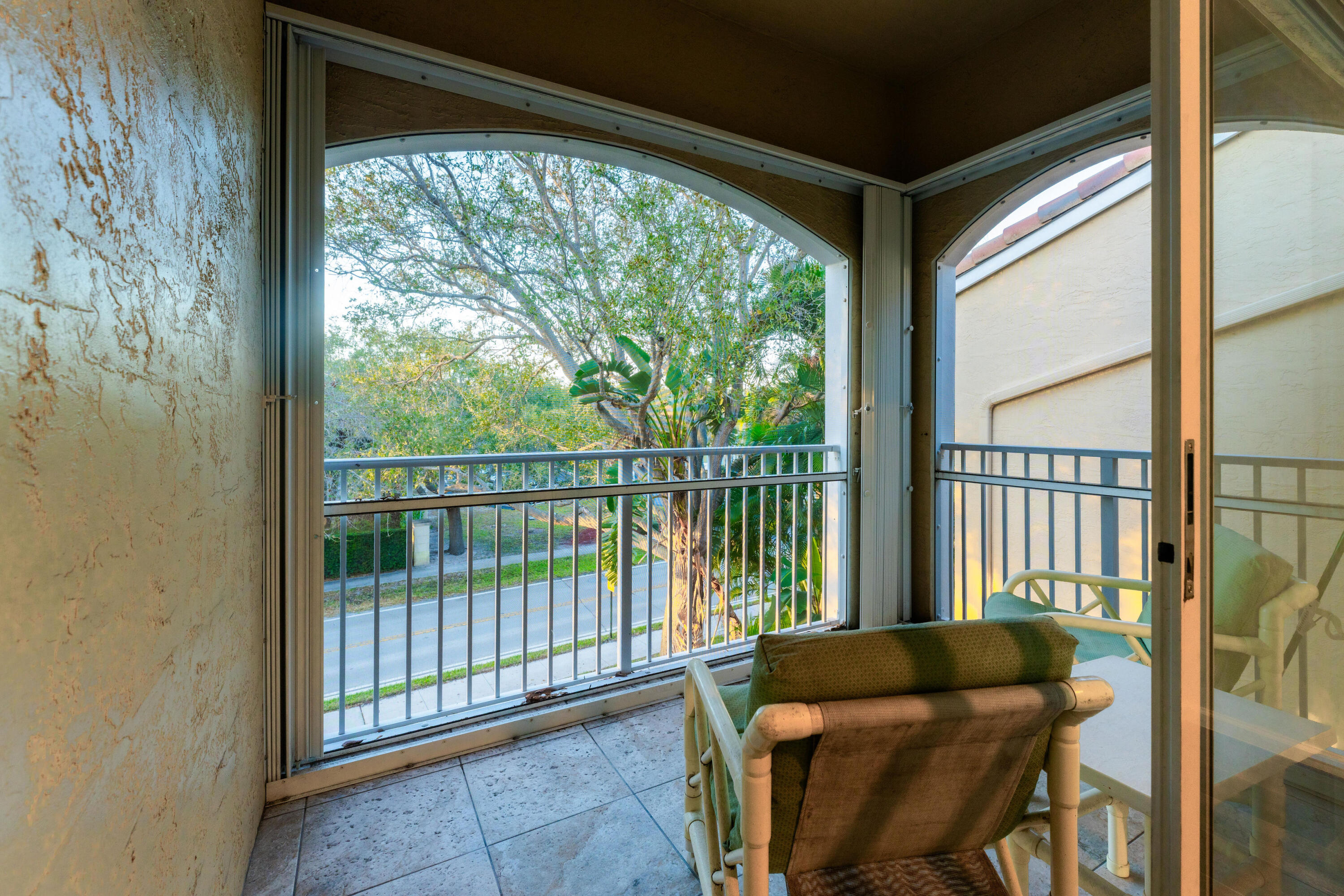 236 Village Boulevard, Unit 1304 Tequesta, FL 33469 - Photo 29 of 30 a living room with furniture and a floor to ceiling window