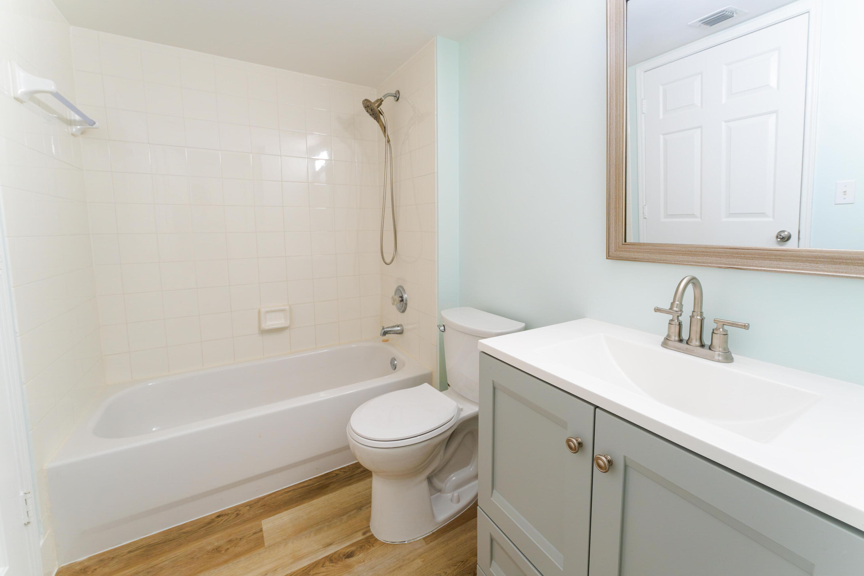 236 Village Boulevard, Unit 1304 Tequesta, FL 33469 - Photo 4 of 30 a bathroom with a sink toilet vanity and shower