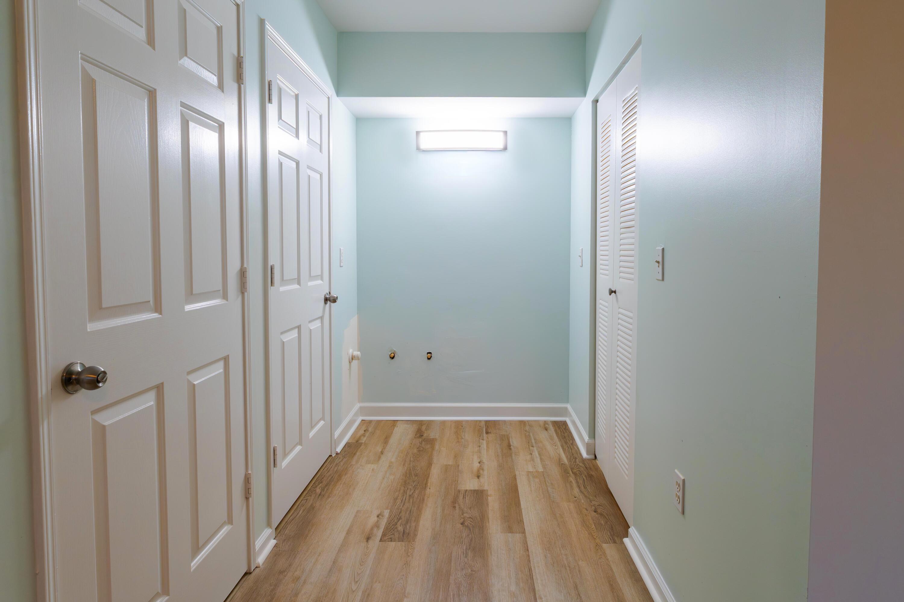 236 Village Boulevard, Unit 1304 Tequesta, FL 33469 - Photo 5 of 30 a view of a hallway with wooden floor
